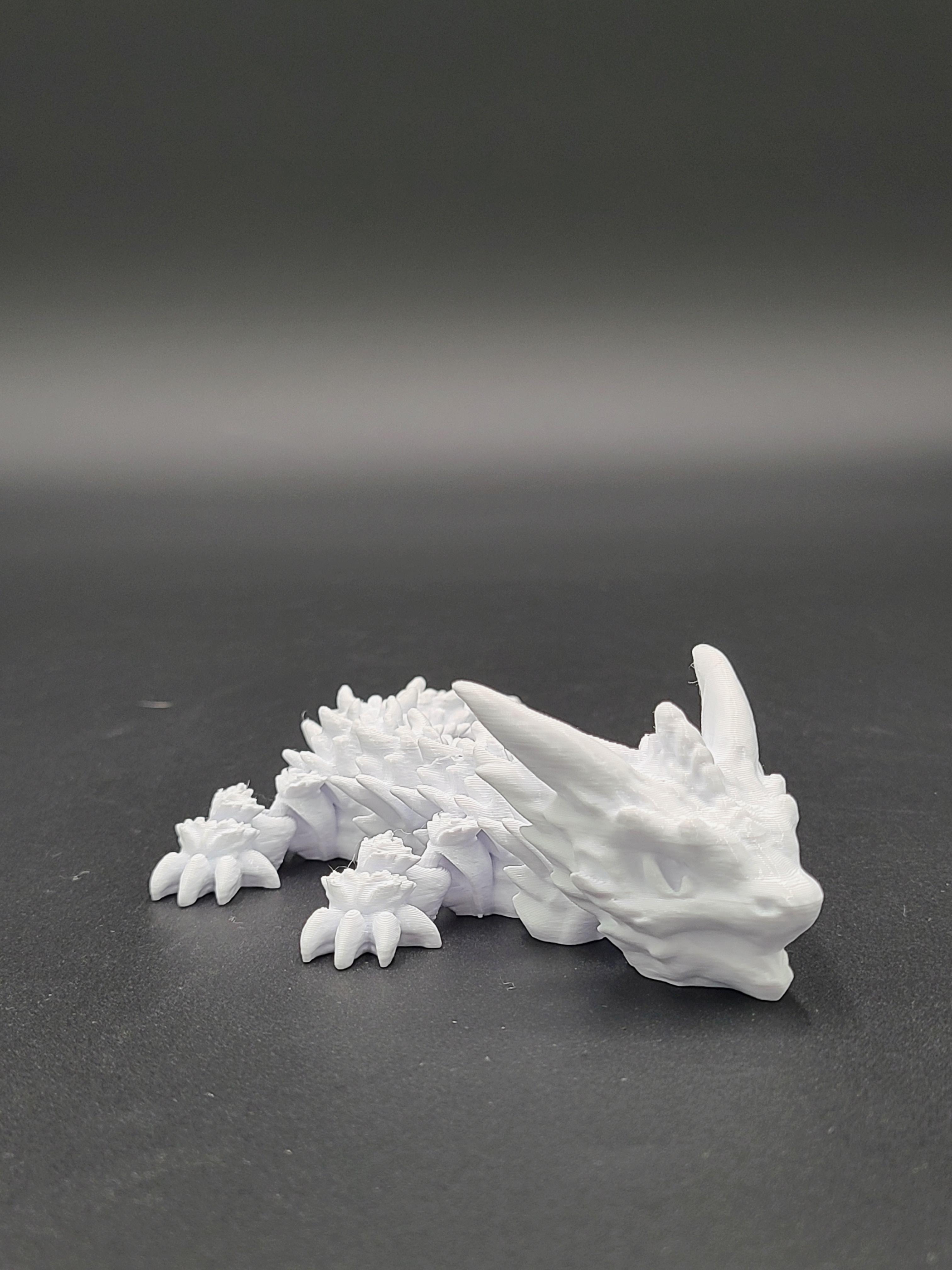 Frostbite, Winter Dragon Child - Articulated Snap-Flex Fidget (Medium Tightness Joints) 3d model