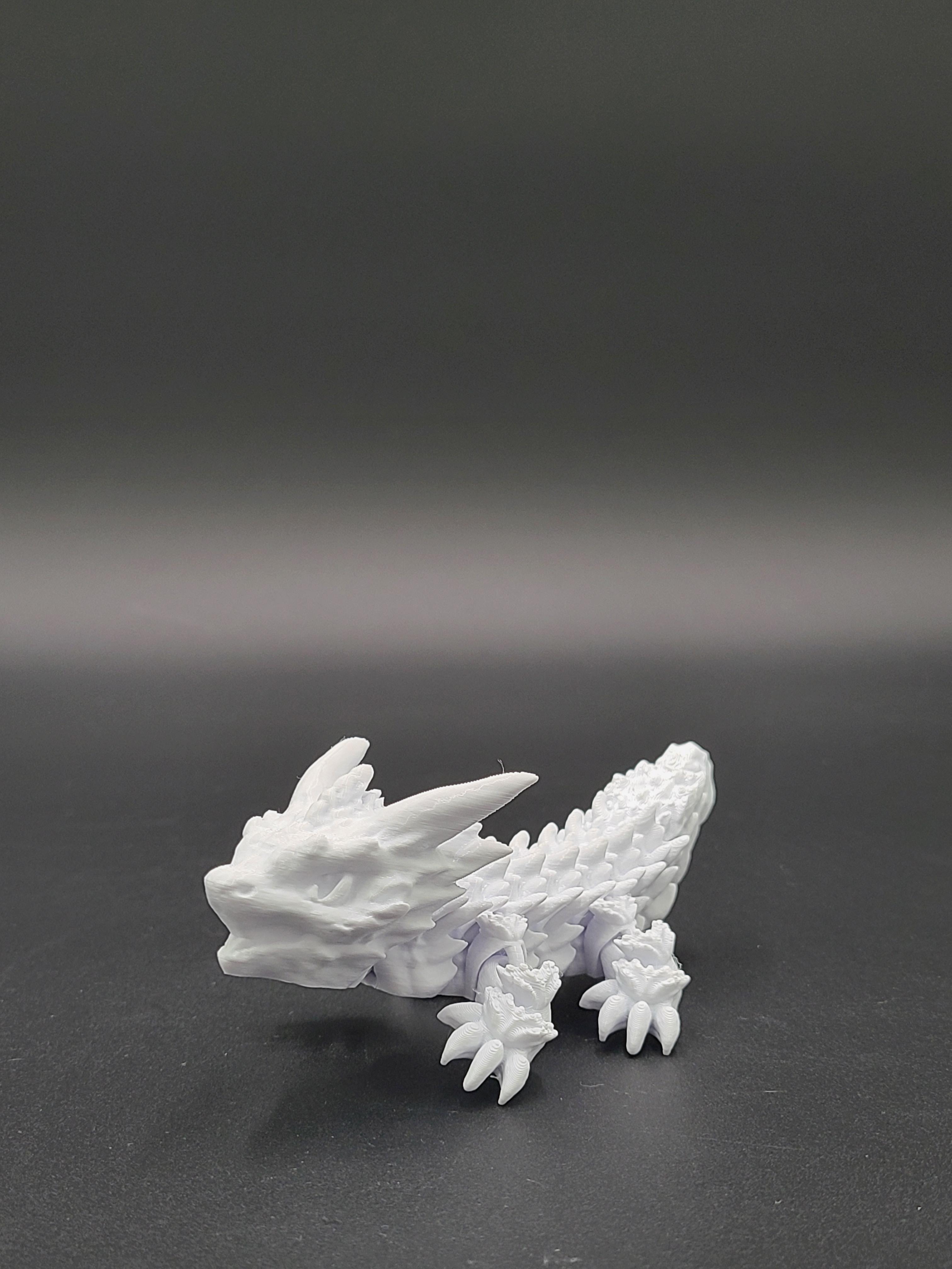 Frostbite, Winter Dragon Child - Articulated Snap-Flex Fidget (Medium Tightness Joints) 3d model