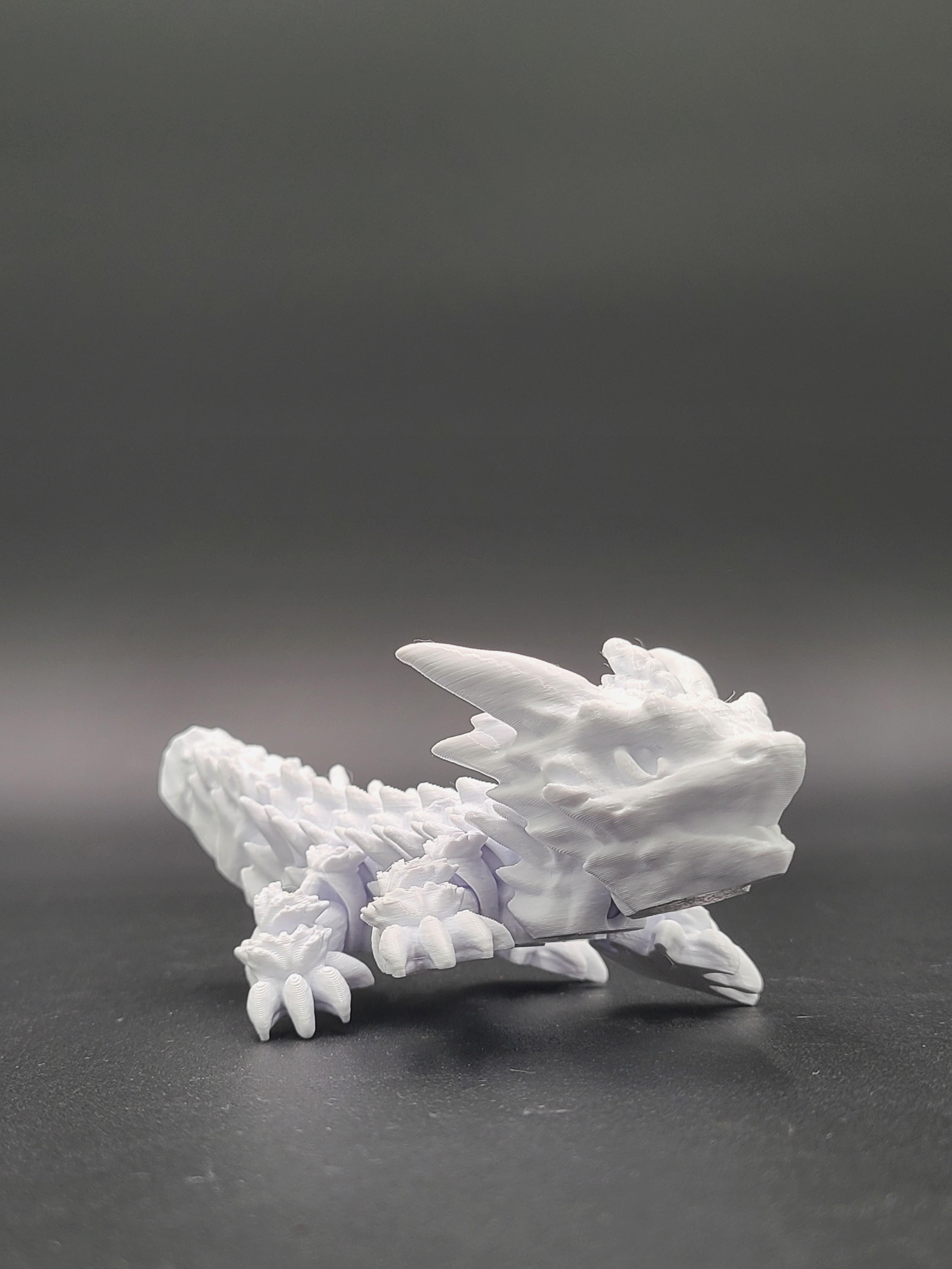 Frostbite, Winter Dragon Child - Articulated Snap-Flex Fidget (Medium Tightness Joints) 3d model