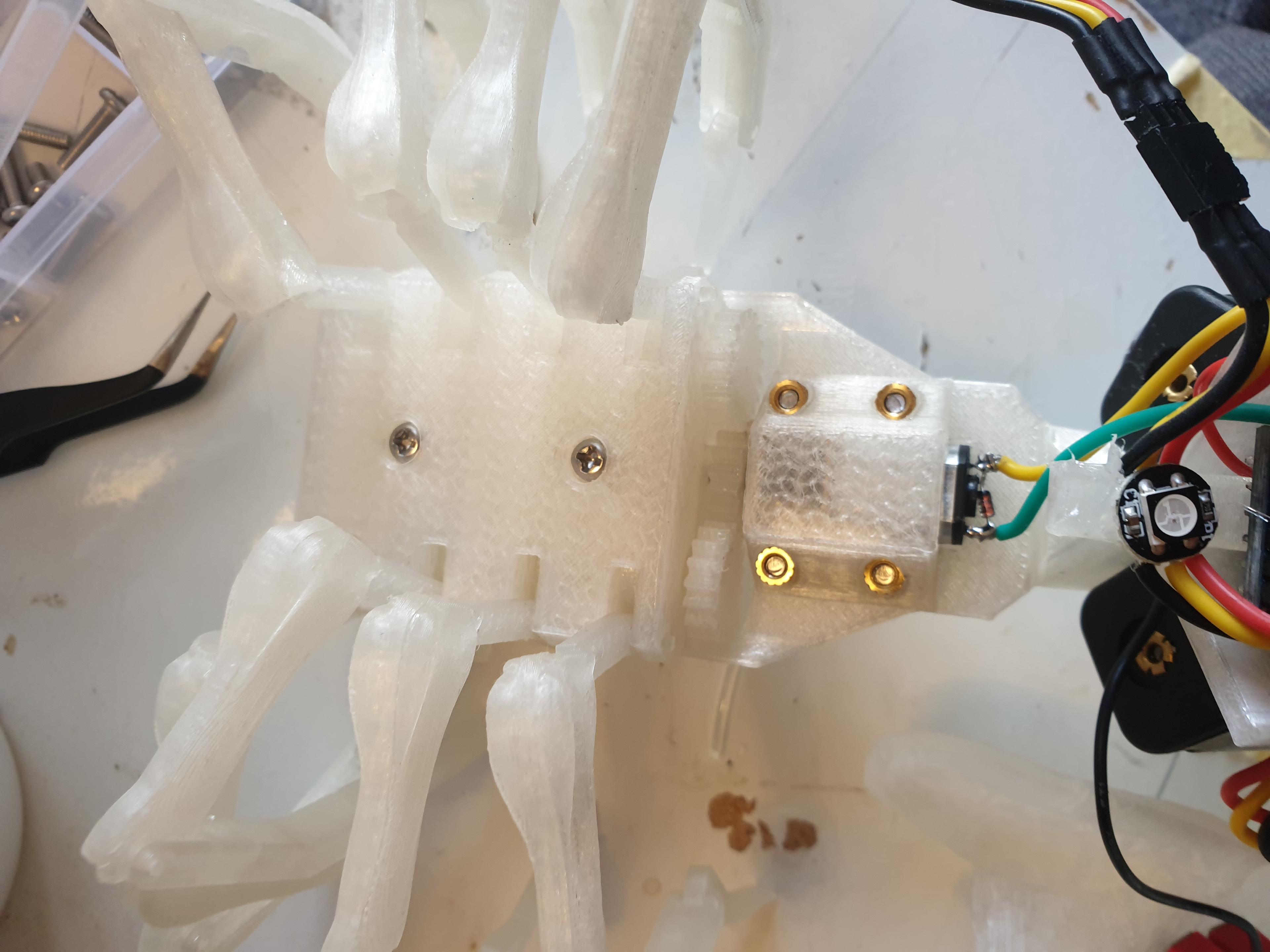 White Widow - a Light Up Head Mounted Animatronic Spider - With the screws on this side the LEDs have to be unstuck to dismantle the spider, in the uploaded stls the screws are on the other side and knurled threads go on the top. - 3d model