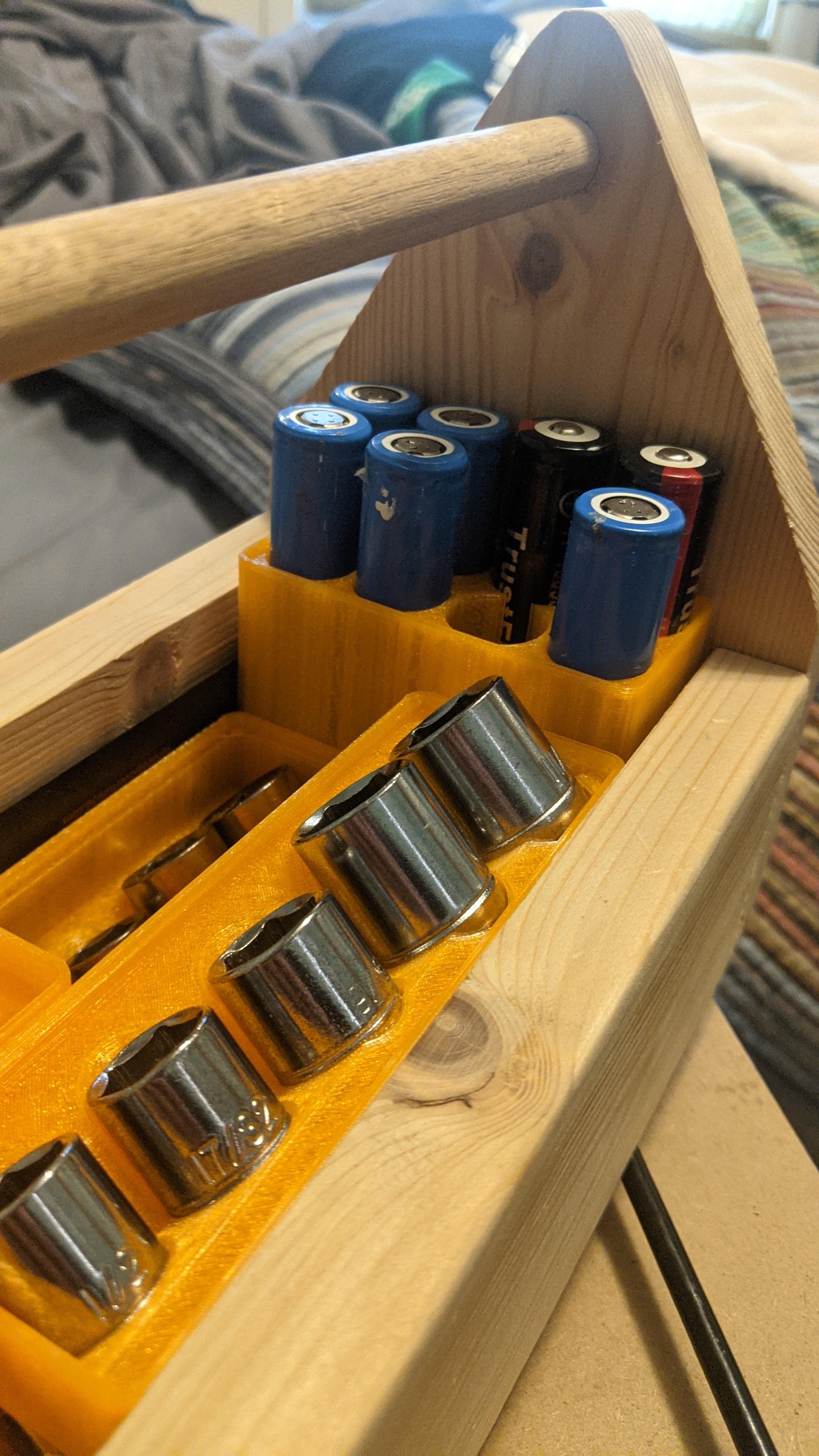 Gridfinity 2x1 8x 18650 Battery Holder - Some of my batteries are taller than the others. (also seen are my socket holders from https://github.com/vector76/gridfinity_openscad/pull/5) - 3d model