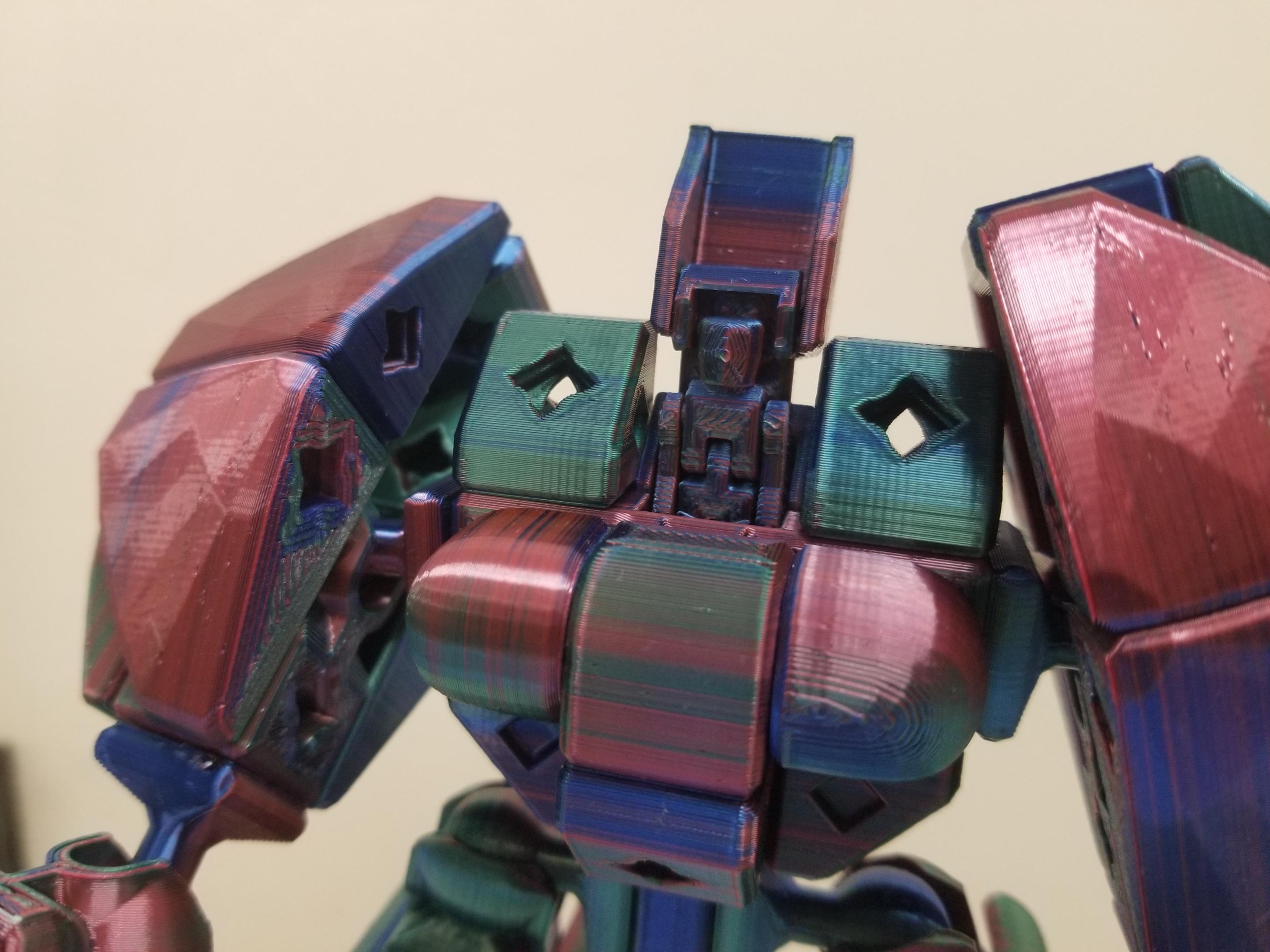 PrintABlok:Battlemecha Frame with basic pilot Articulated KitBash Model - I changed the frame to give it back swept feet and used Prettifier bloks to build out the shoulders and bevel blocks to build up the front and the back.
I call this one "Chonky boi". I open to other suggestions. - 3d model