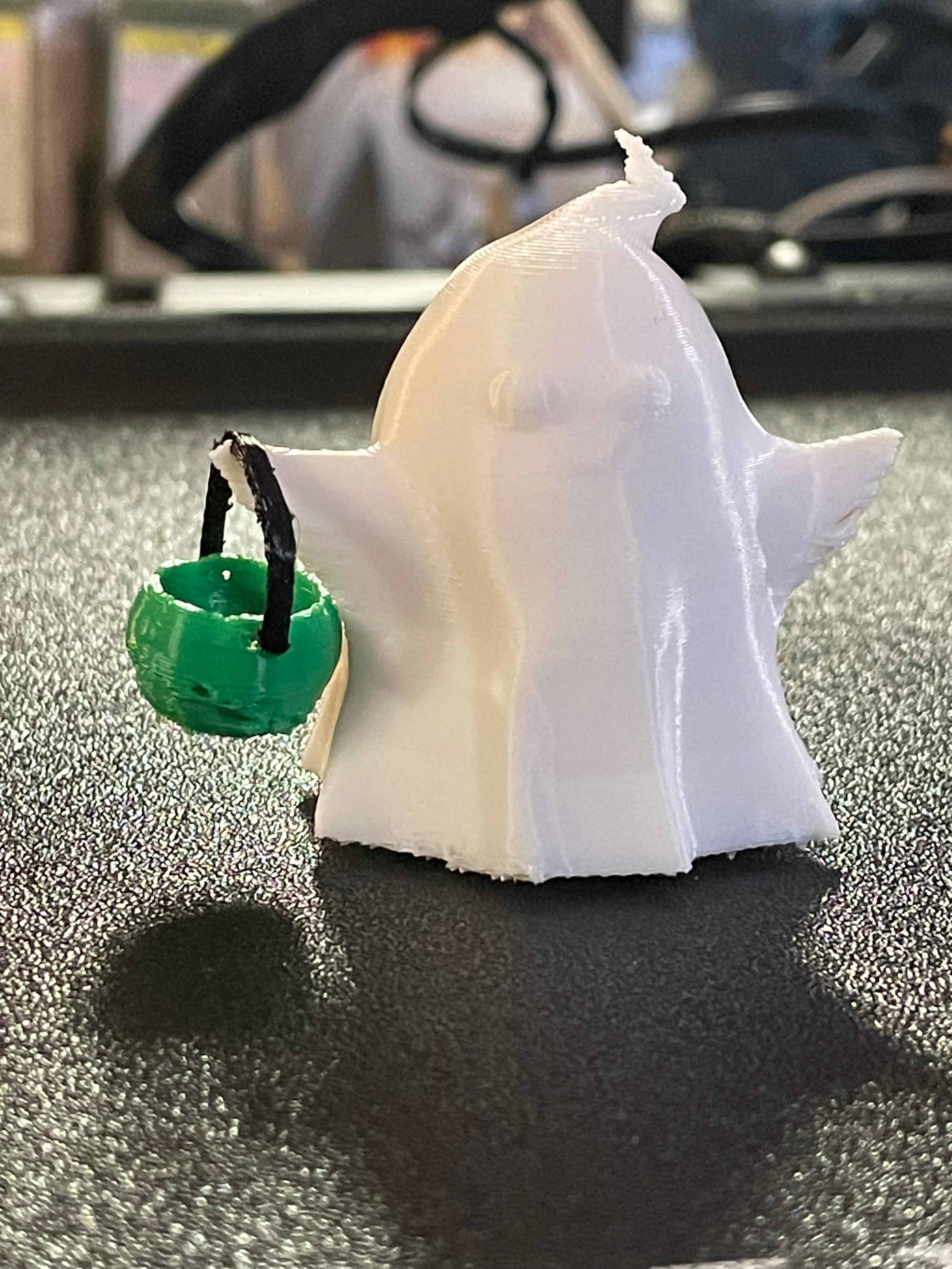 Halloween Ghost Holding a Pumpkin Basket - Printed in 3 different colors of pla+, no supports, and without a parts cooling fan, this little guy came out very well! Can't wait to print an army of these! - 3d model