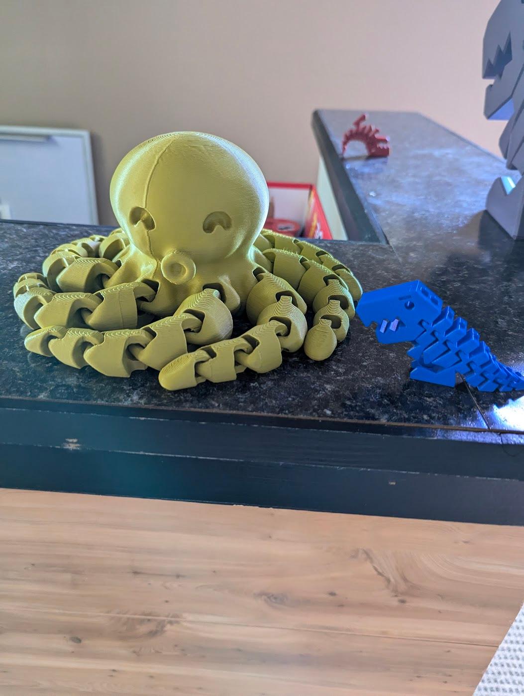 Cute Mini Octopus - Big Octopus, Scaled up around 350%, I don't remember exactly how much. Normal scale flexi rex, https://github.com/DrLex0/print3D-FlexiRex, for scale. Also there is a giant flexi rex off to the side. - 3d model