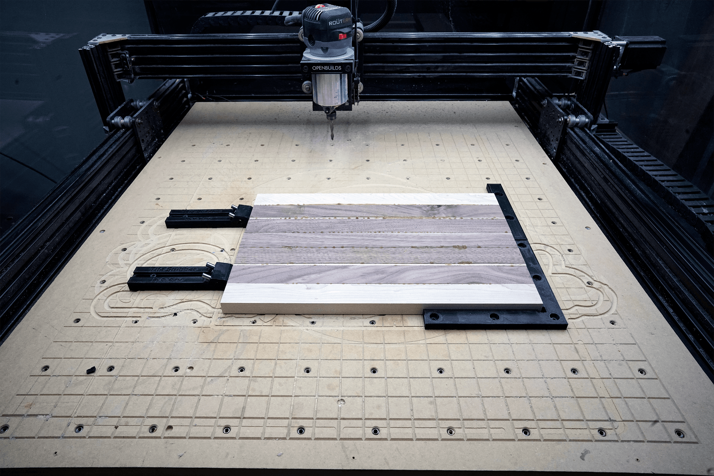 Low Profile Toe Clamp for CNC Router (Hex Nut Version) - This cutting board if firmly held by two toe clamps pressing the board into the right-angle jig. The entire top of the cutting board can be faced/carved without running over a clamp. - 3d model