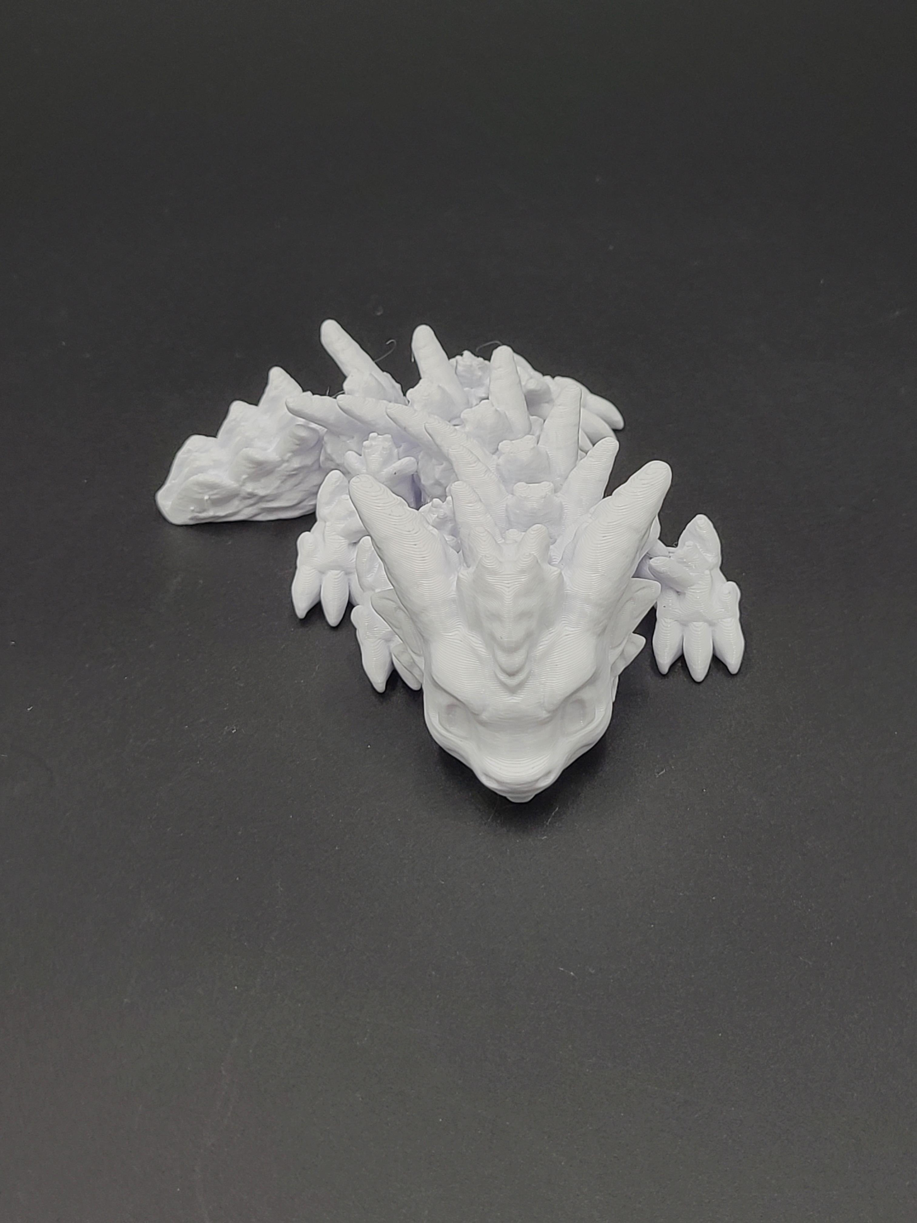 Cold Snap, Winter Dragon Child - Articulated Snap-Flex Fidget (Medium Tightness Joints) 3d model