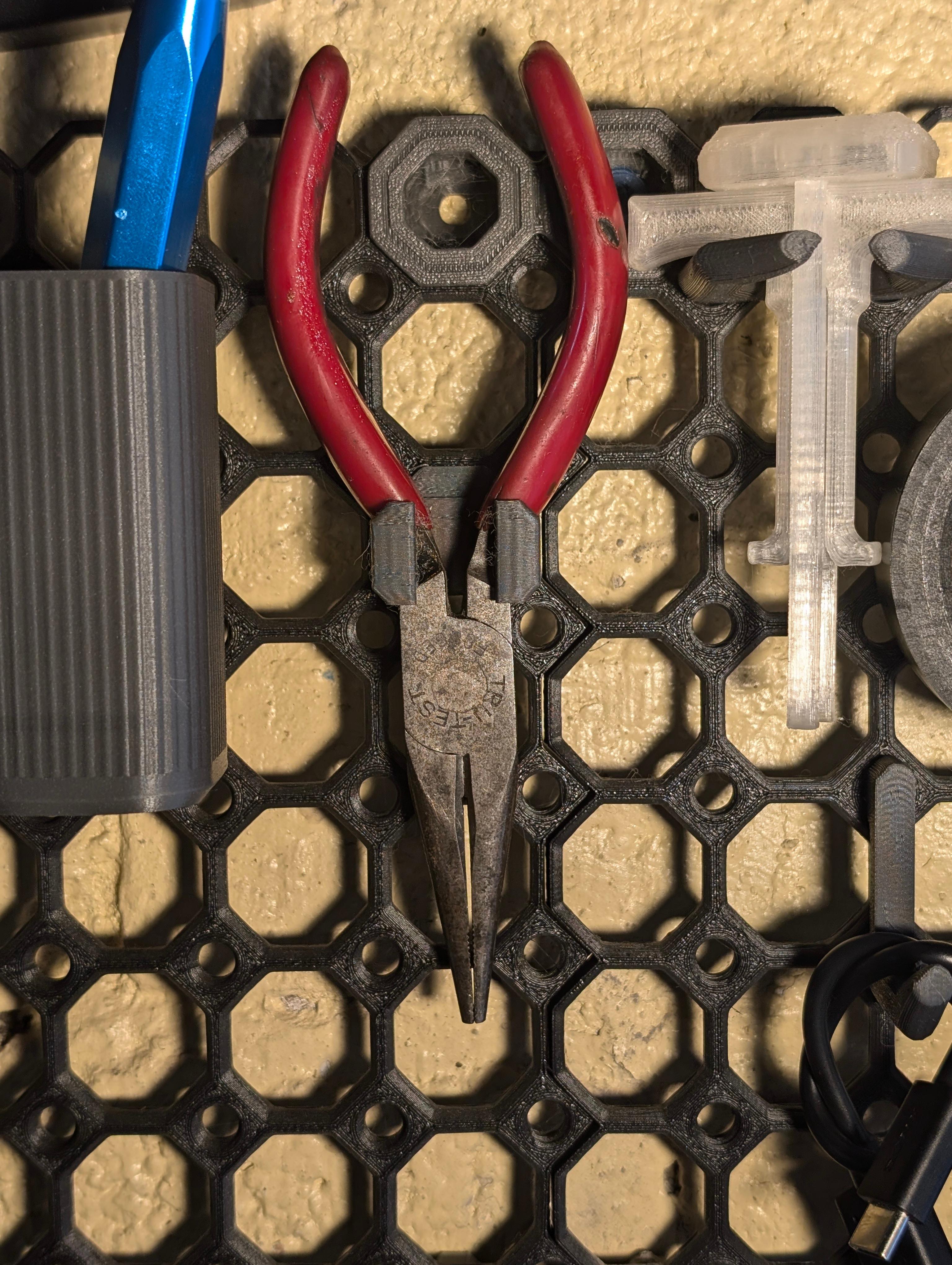 Universal Pliers and tool Holder and cable management Multiboard remix - I sliced off the bottom so I could print it in the shown orientation.  No functional issues with the shown prototype (printed at 200% speed).  - 3d model