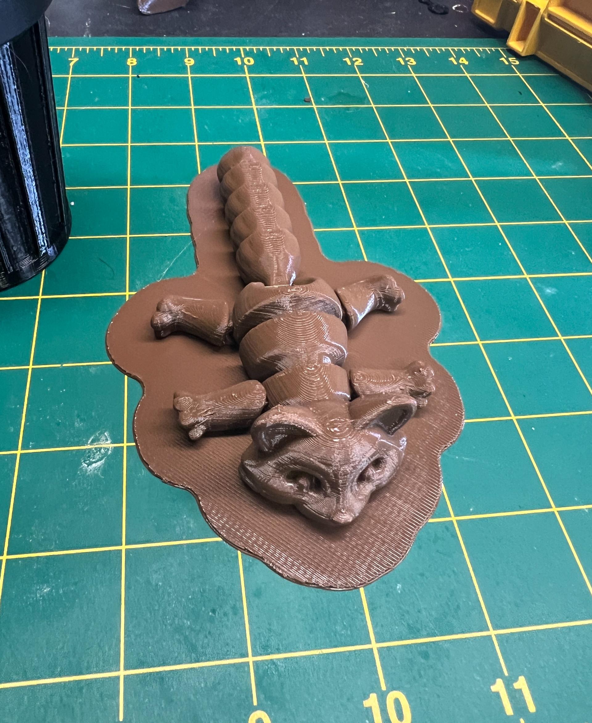 Articulated Racoon - After a few failed prints with the nozzle lifting up small sections of the print, I tried glue and hairspray with no luck. Eventually added a raft and got a successful print - 3d model