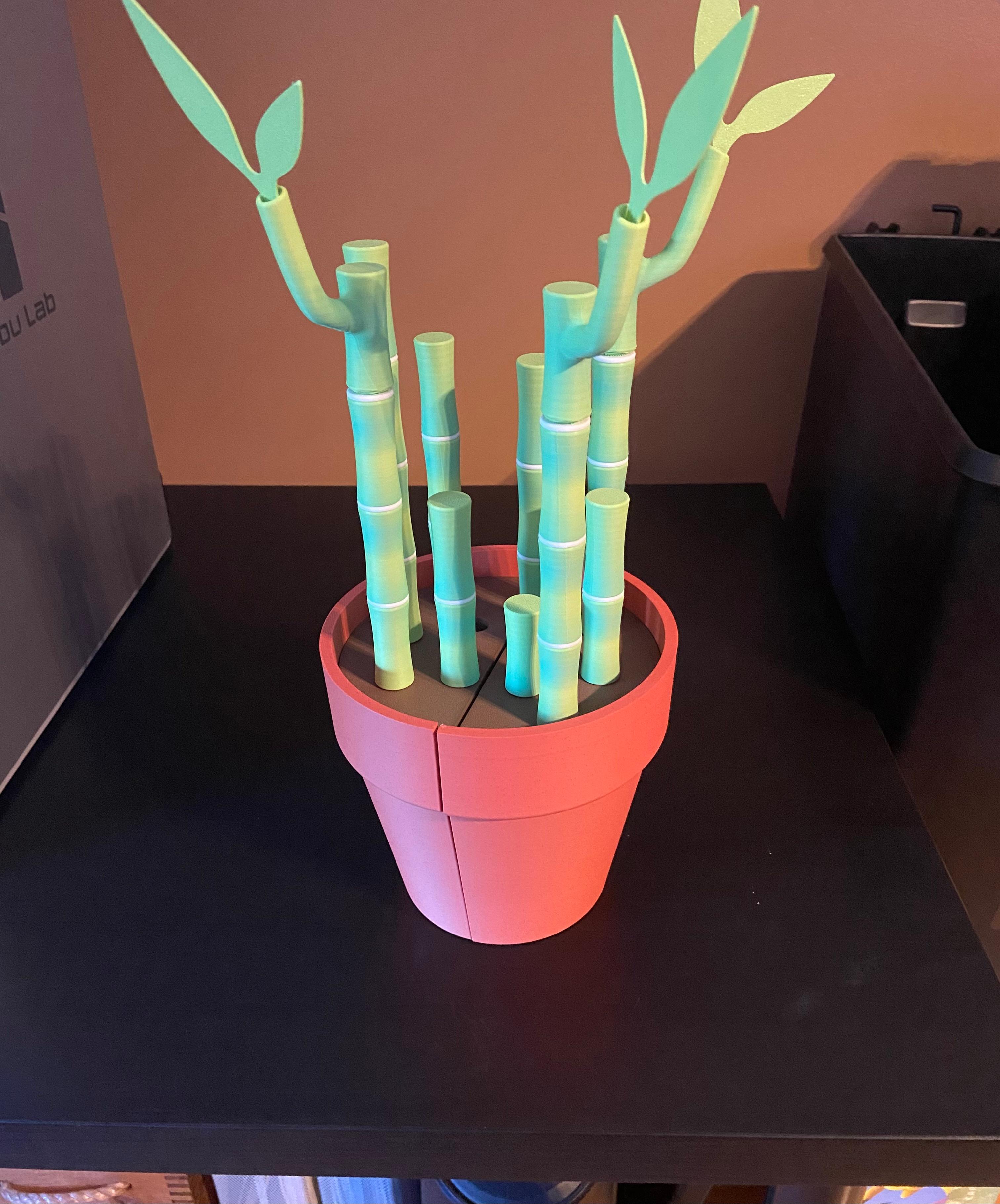 Bambookends - Bamboo Functional Plant with Pens, Highlighters, Post it note dispenser, and Bookmarks - Repost for the giveaway, made for my sister for her birthday! Turned out great, I didn’t use supports for the pot and used the provided 3MF file for most of the parts. - 3d model