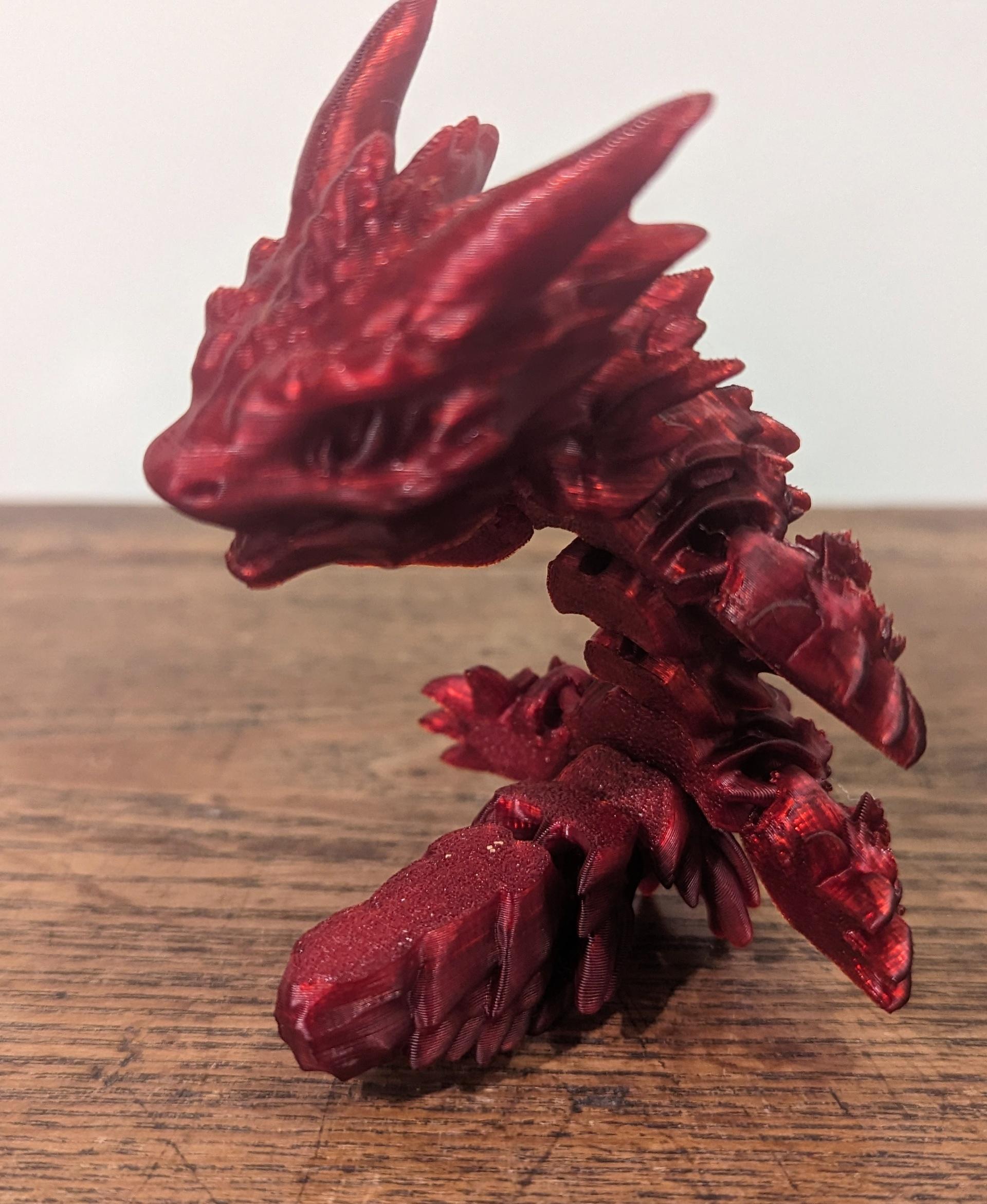 Frostbite, Winter Dragon Child - Articulated Snap-Flex Fidget (Medium Tightness Joints) - FrostBite printed on the KP3S in Coex3D Translucent Blood Red - 3d model