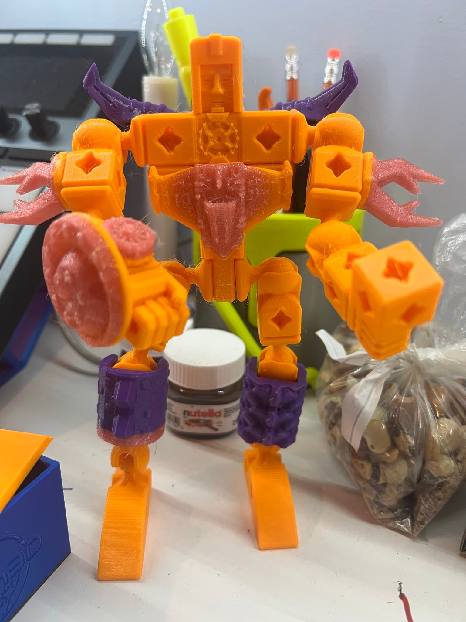 I liked the idea of combining the mecha with the animal parts, so used the dragon and snail bits, along with some body pieces to accessorize the bot!