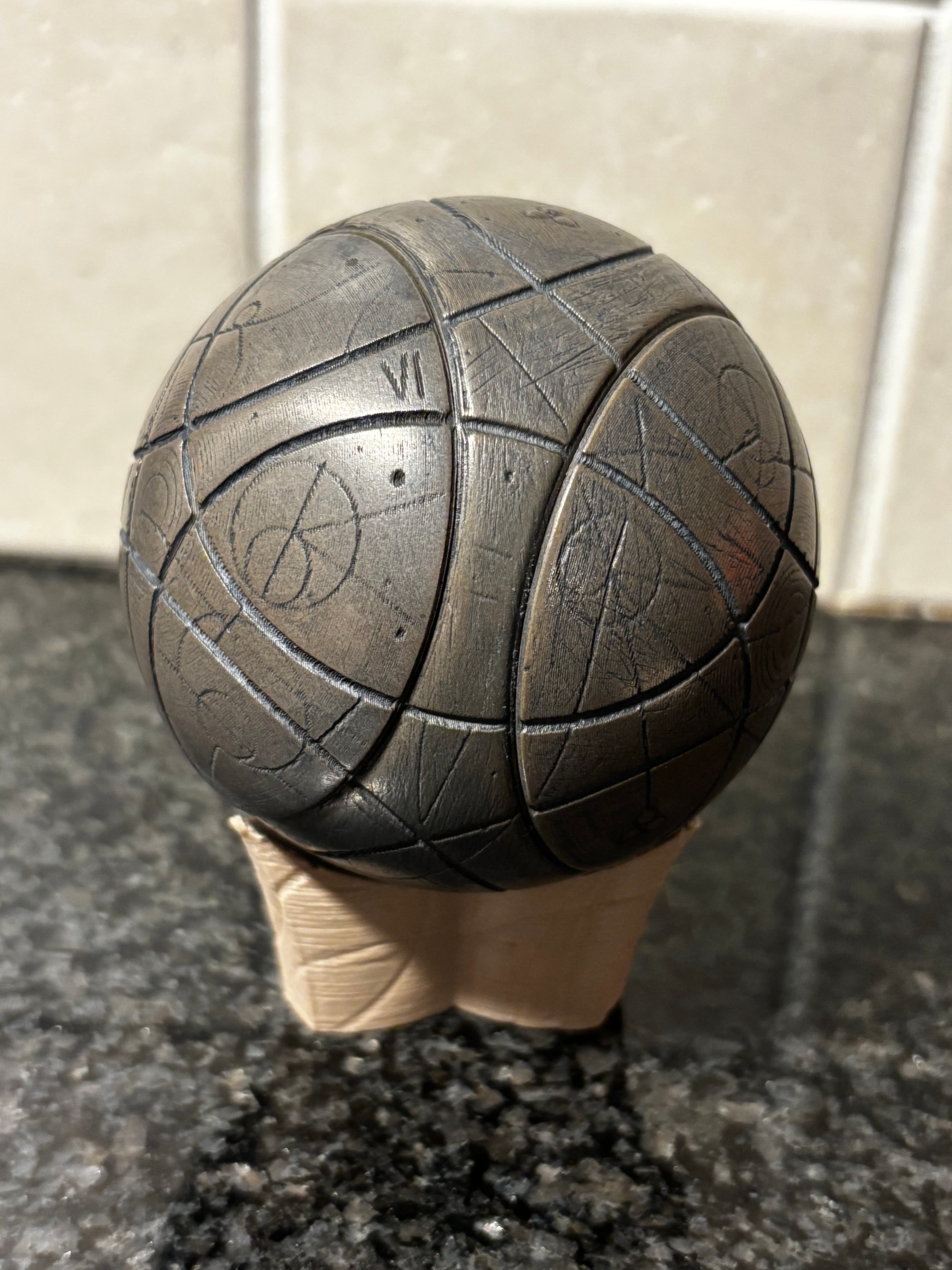 Bronze metal-filled PLA. Sanding and a lot of polishing.