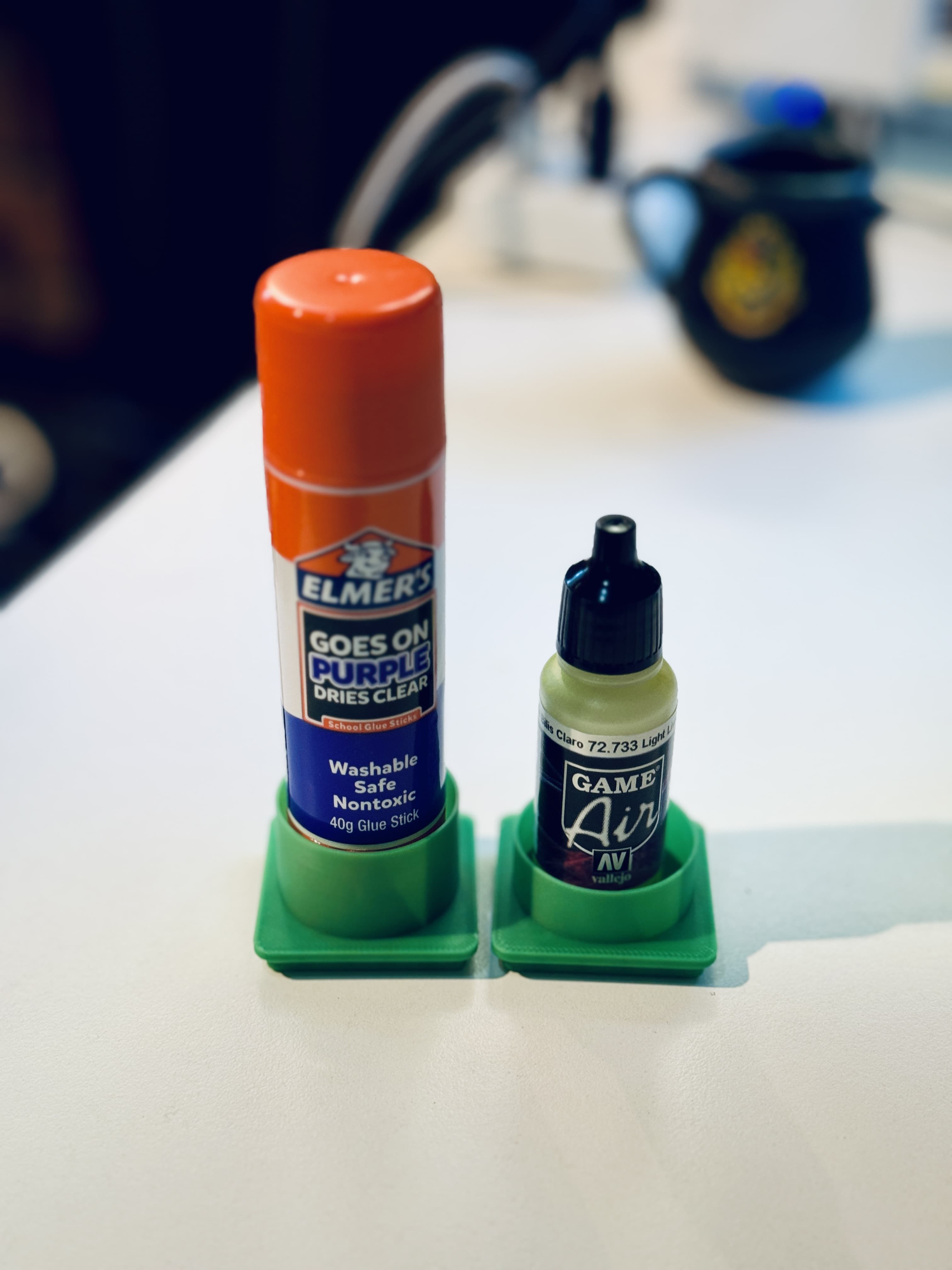 Internal diameter when printed is 33.1mm. The bottles I had were too big, so I found some other props for the models to pose with.