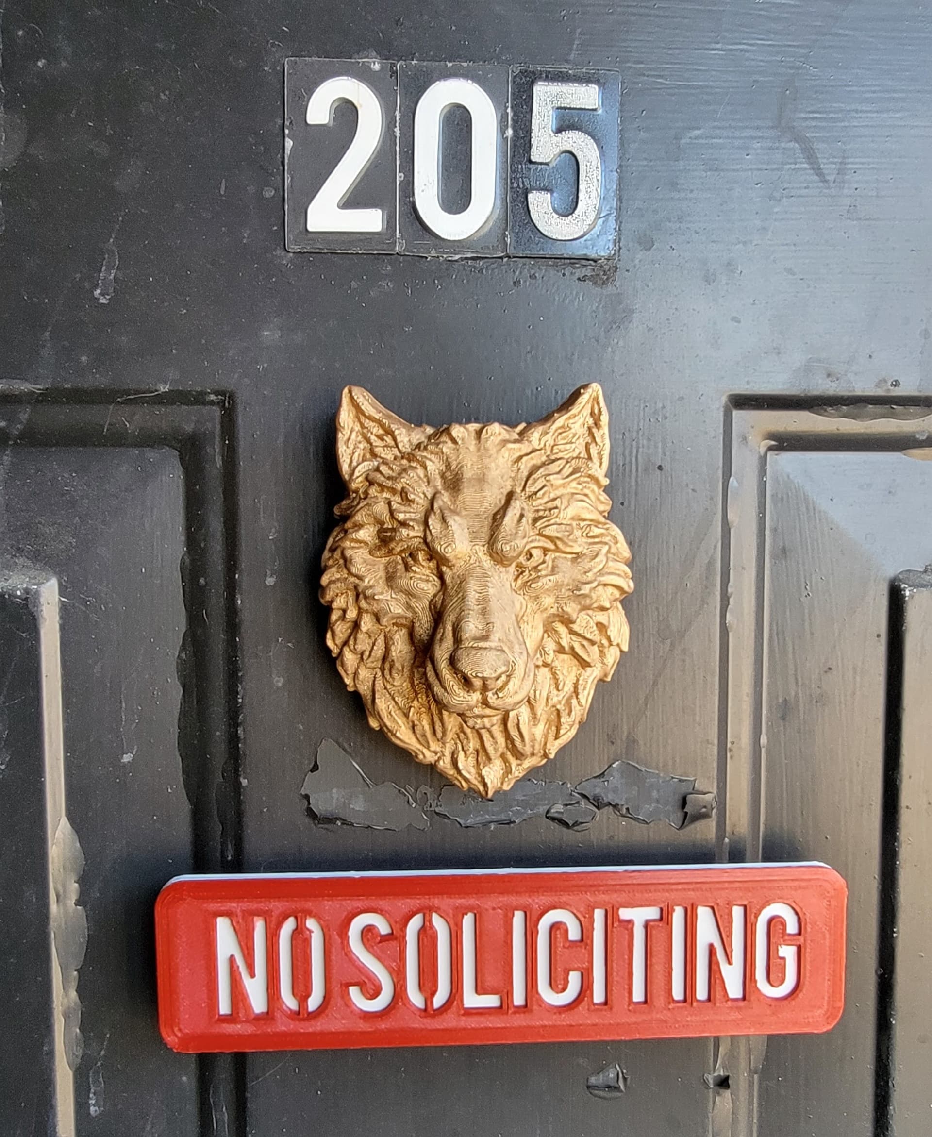 Front door, turned into a magnet, painted in "antique gold" Rub 'N Buff