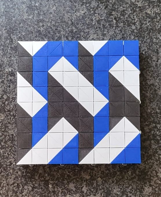 Inspired by Escher! I also made the sides of the Auxetic cube in the colors Blue, White and Black!