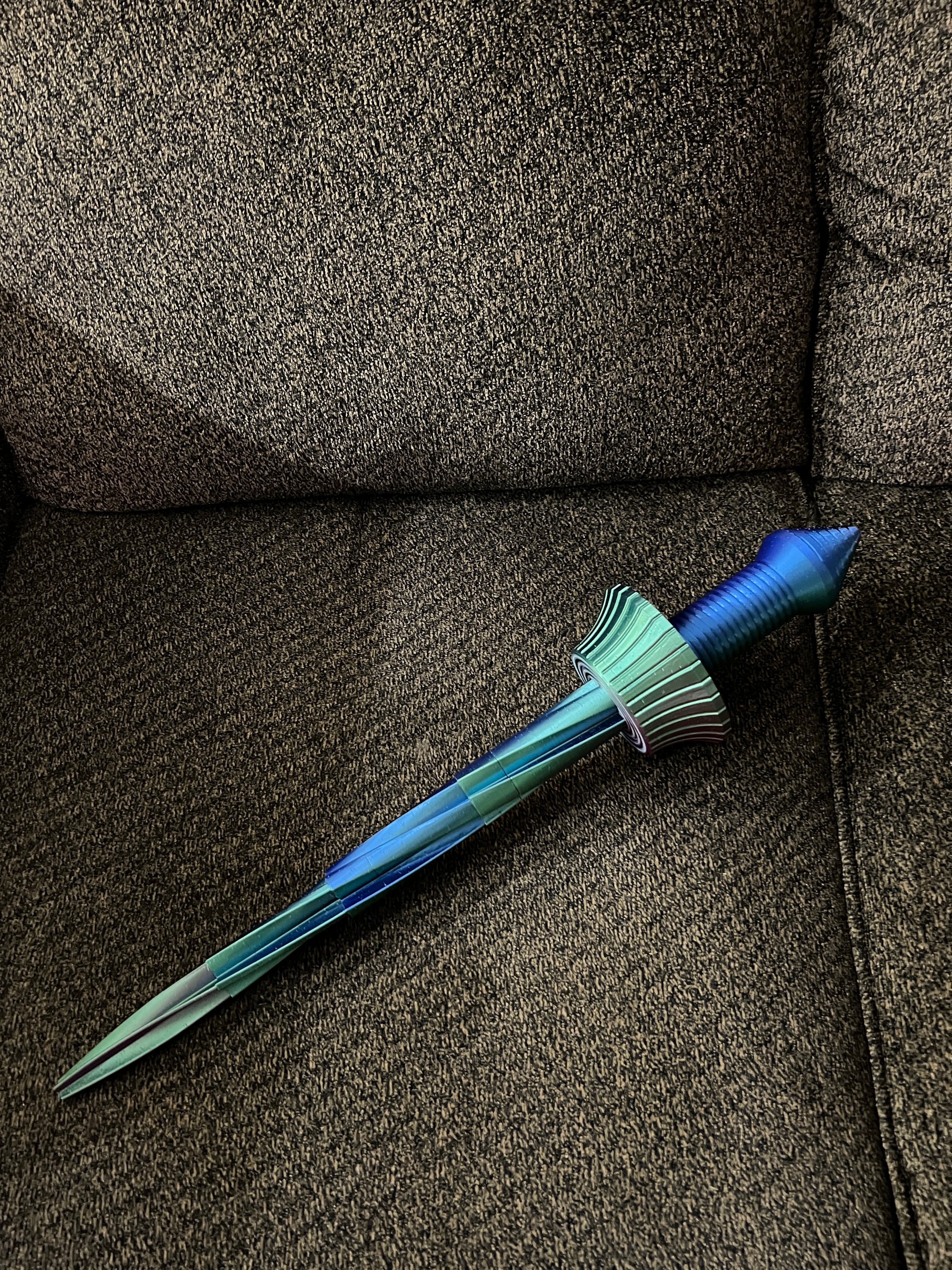 This may help some of you. I pushed the blades in twords the pommel first. This broke the blades loose so they would extend.