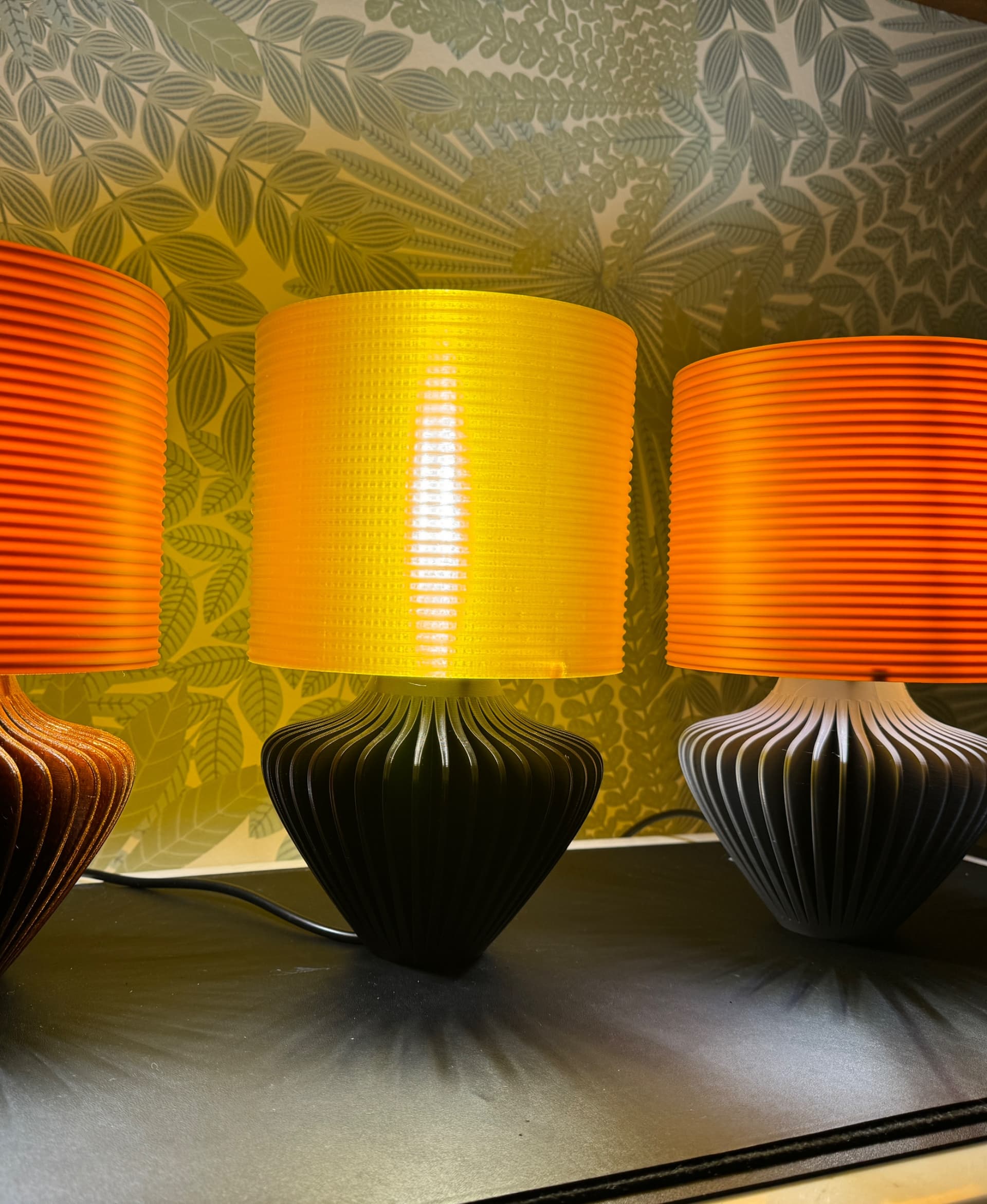 Base in PLA, shades in ABS. Possible to creat some really cool effects with SVG emboss. Designs visible only when light is on.