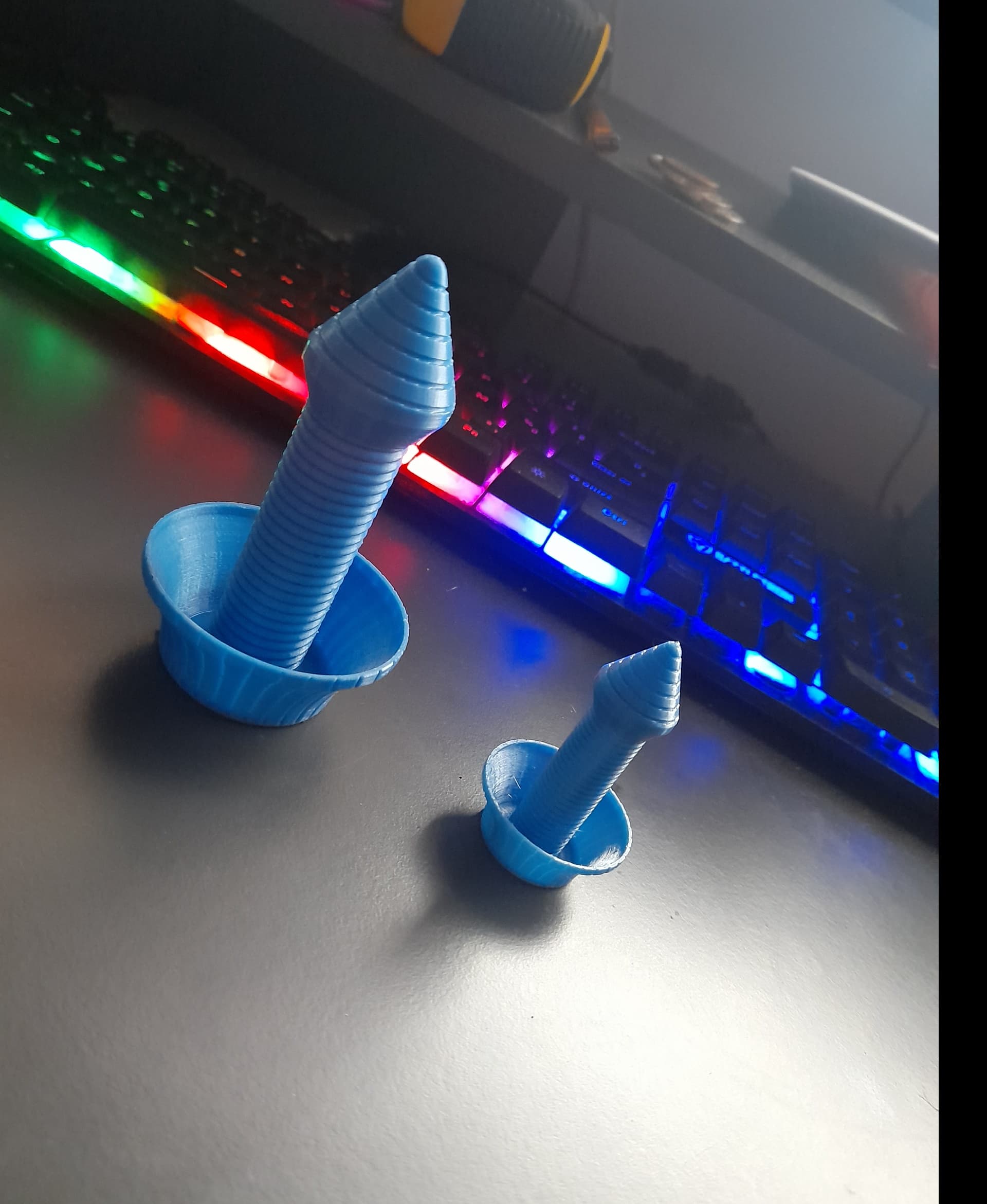 hey i printed this as a test in a smaller version everything went good the big one is a 50% the small one a 30% model butt then this happend on the bottom the small one dont got nothing inside xd and the larger one is like melted to gether my bed is at like 50 pre heat nozzle 200 any tips