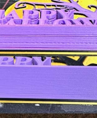 The stl has issues in the lettering. It looks like you layed several copies on top of each other with defined to and bottom layer. I ran the stl thru a repair service which too care of most of the issues. Top model is before repair.