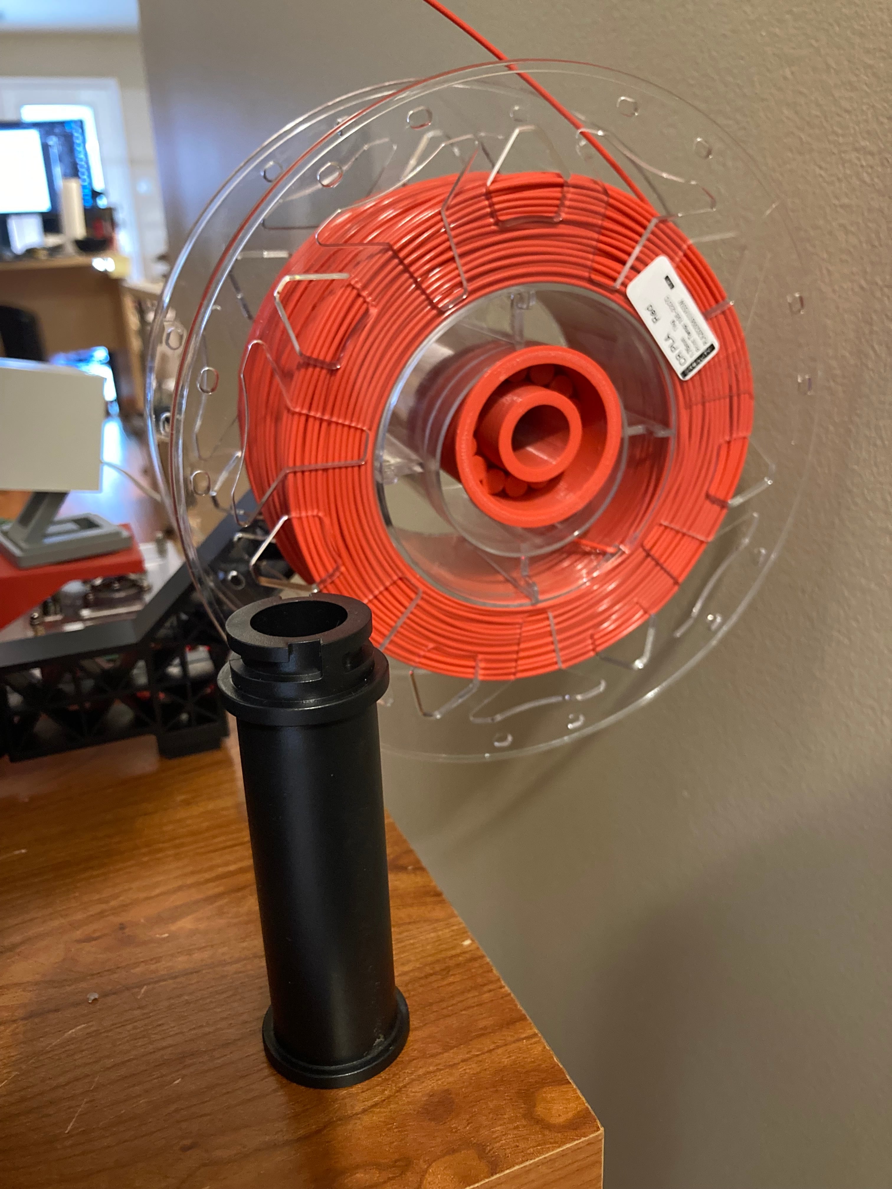 New spool holder next to old spool holder.