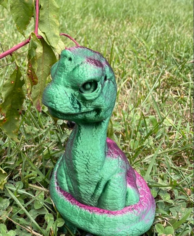 Baby Dino in green and raspberry.