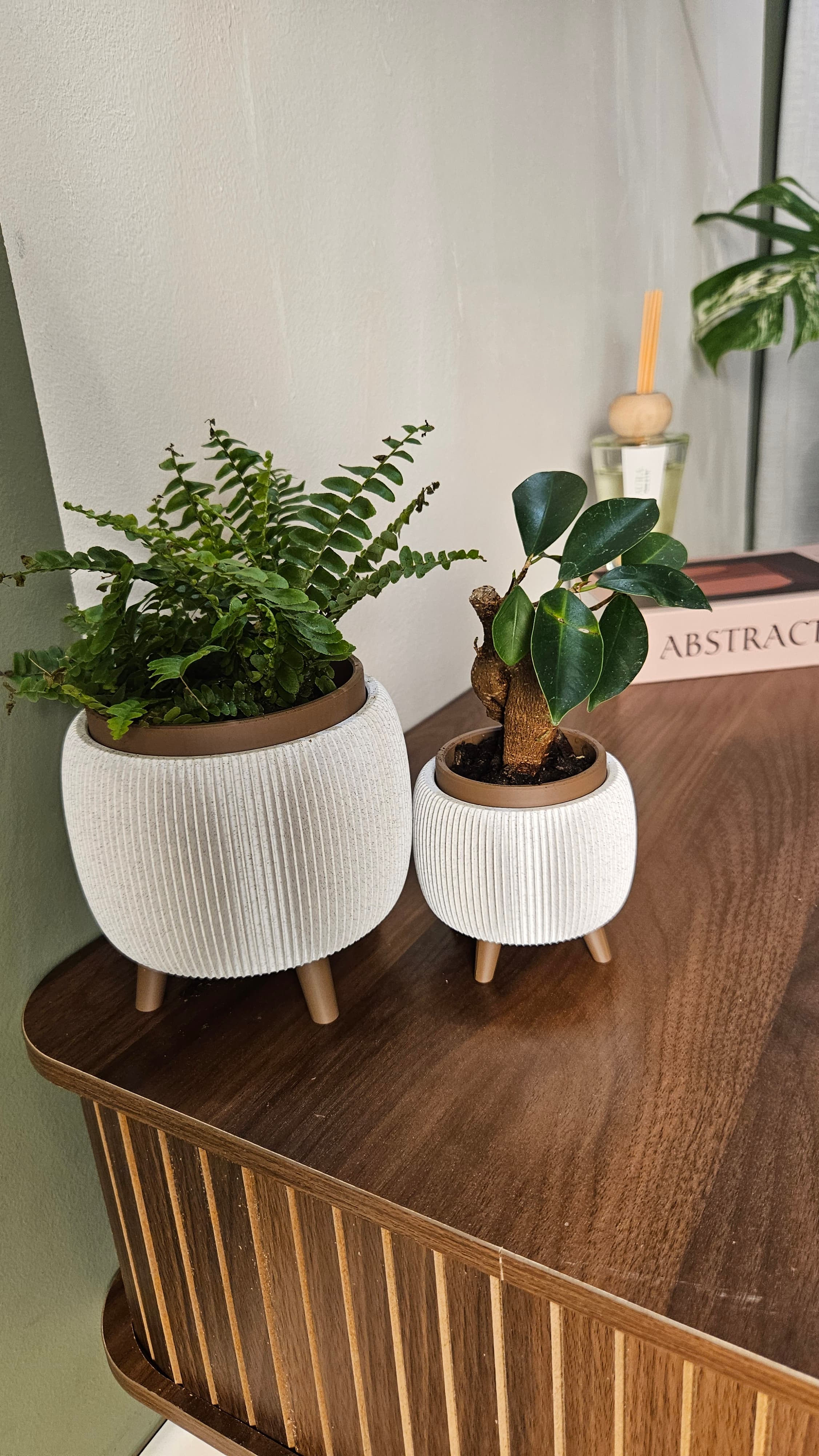 Printed now with polyterra brown to match the japandi style. other one is bambu PLA marble