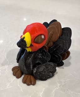 Repainted this a little bit into an Australian Bush Turkey edition. Printed at 75% scale with various filaments:
* Prusament Galaxy Black
* eSun PLA+ brown and yellow
* Generic PLA red and white 3d model
