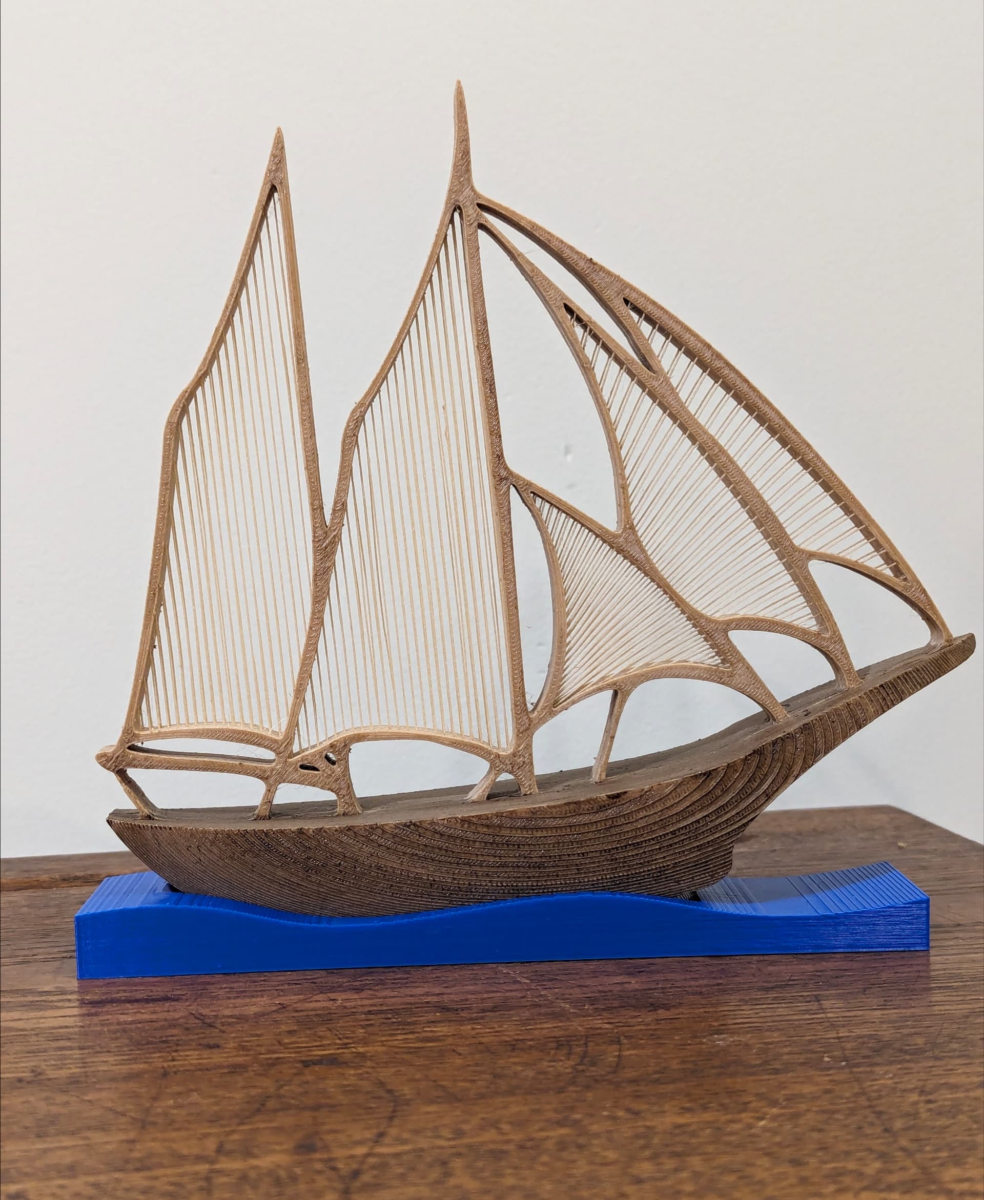 Printed on the Prusa MK3.5 in Sliceworx Wood PLA stained with Minwax Golden Oak and Mission Oak. The stand is in Sliceworx Royal Blue.