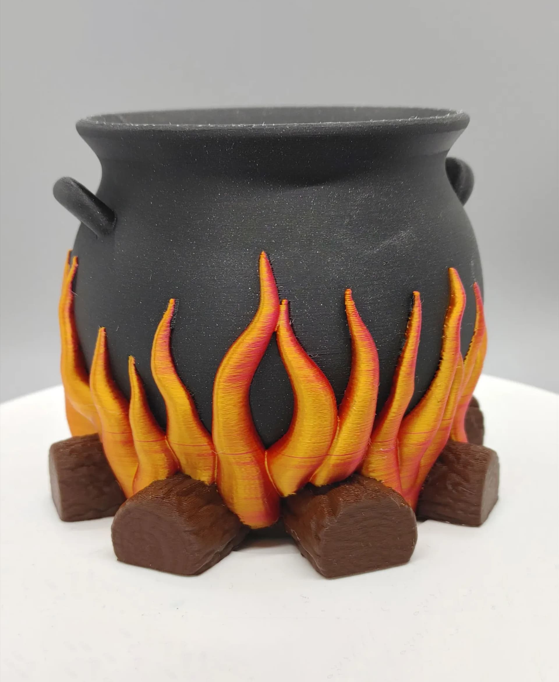 Love how this turned out! Such a great model. Printed in Printed Solid Soul Black Glitter & Tree Brown PLA and Eryone Dual Color Red & Gold Silk PLA on the Bambu X-1 Carbon using the AMS.