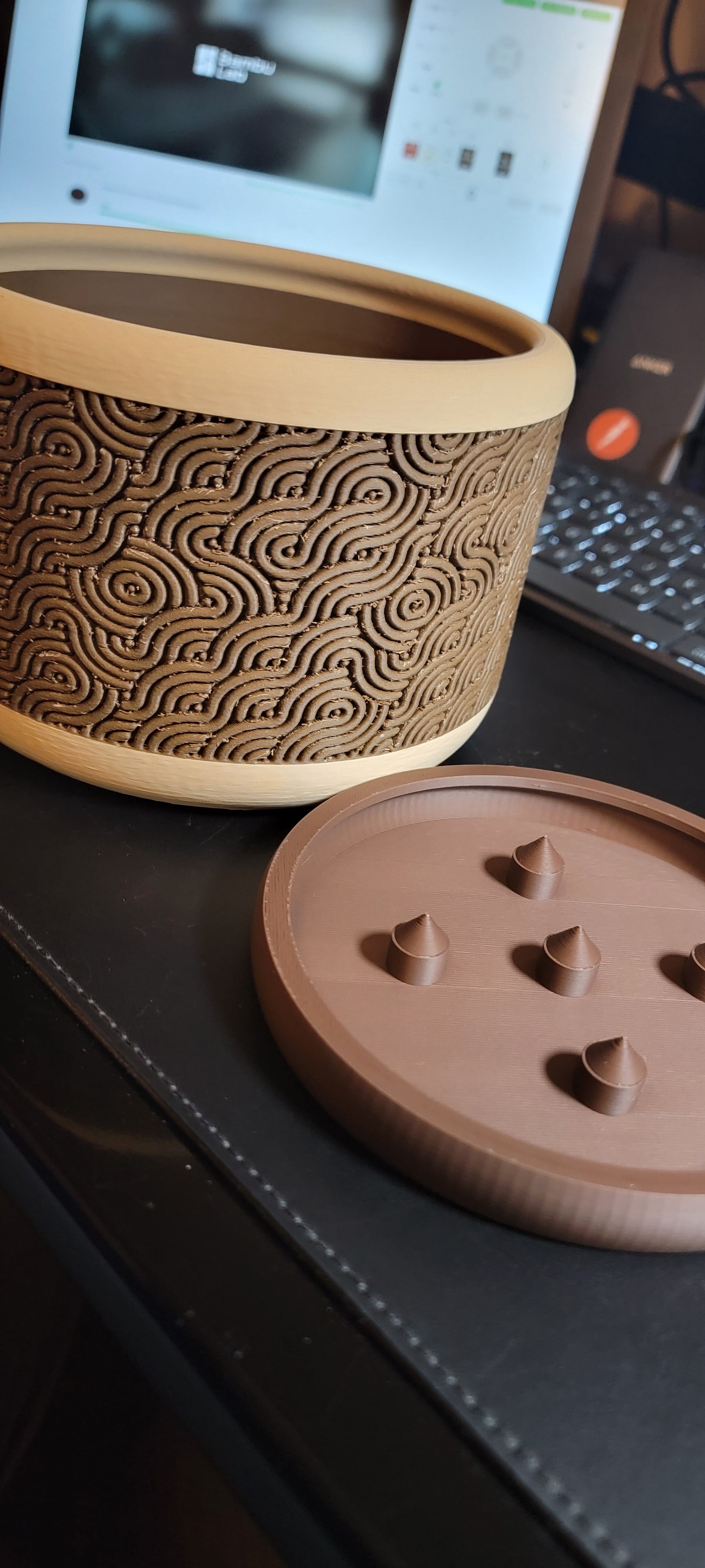 Make a change to the tray so the pot didn't slide off too easily. The main dark color was PLA Wood and I think I didn't dry it enough since you can see some issues with the under or over extrusion.