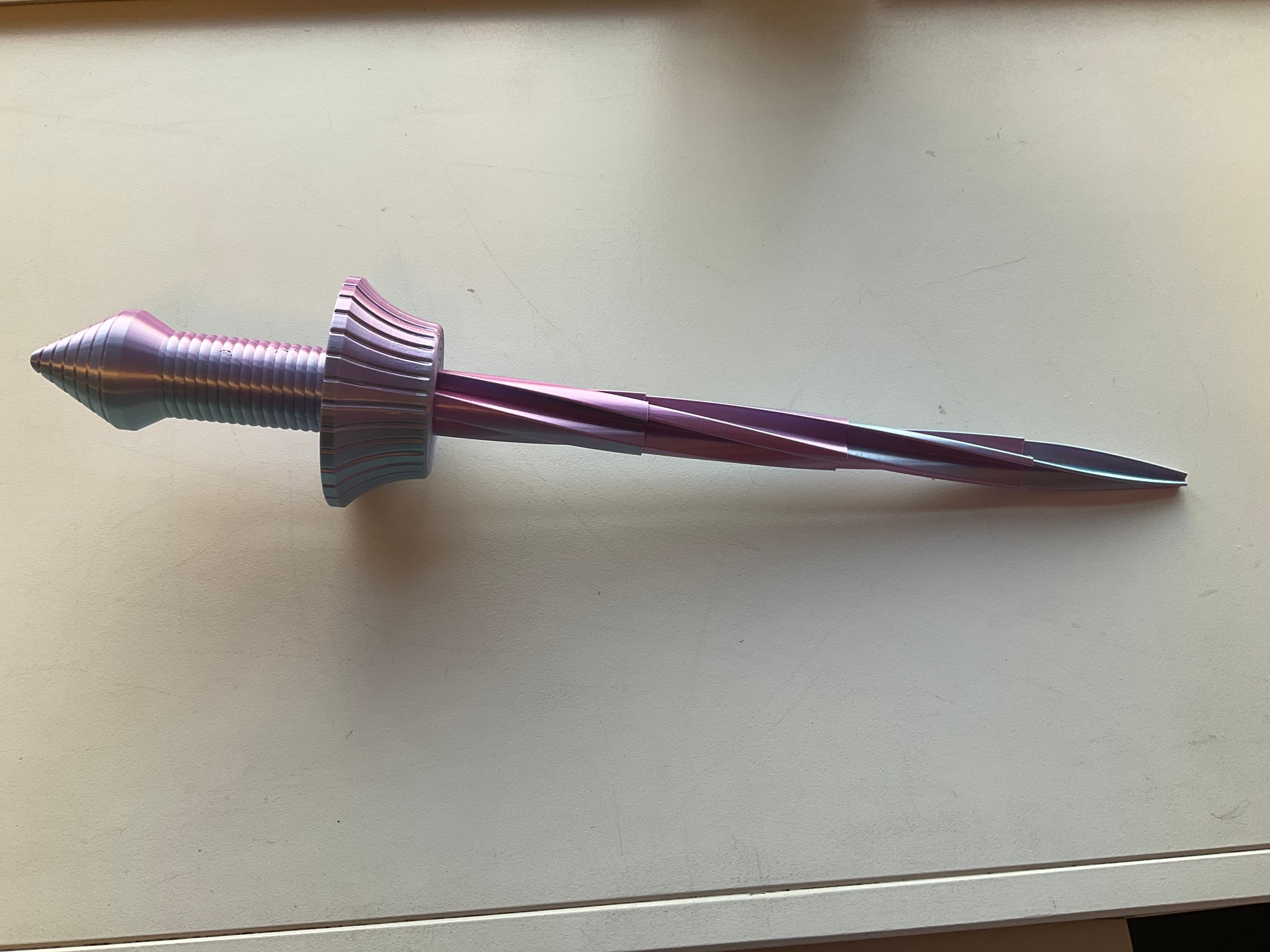 Printed this on my X1 Carbon, have had the X1C for about 1 1/2 years now and have printed 3-4 swords of similar designs, this one has by far been the most reliable for strength and build quality. I printed this with a "Blue and Pink" silk PLA+ which imo turned out amazing. I highly recommend this print to anybody with a Higher or Lower quality printer as it has been designed amazingly and prints easily in one piece which does require some consistency in tolerance.
