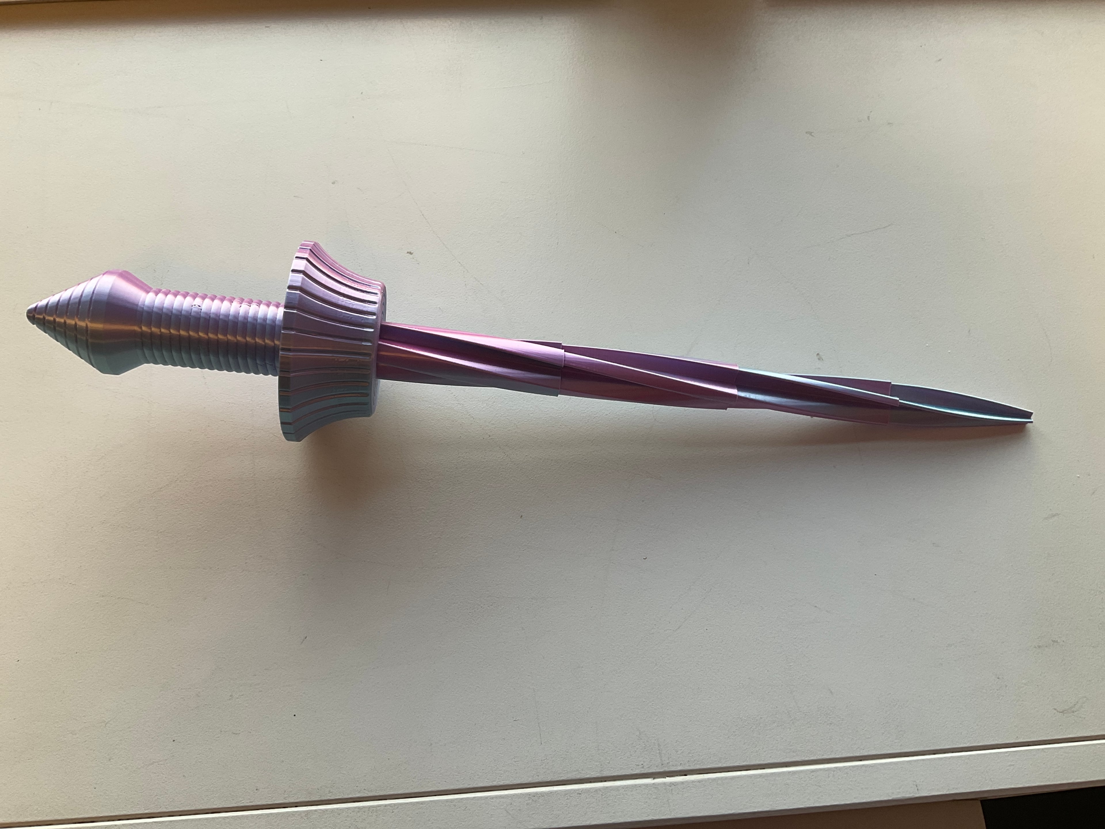 Printed this on my X1 Carbon, have had the X1C for about 1 1/2 years now and have printed 3-4 swords of similar designs, this one has by far been the most reliable for strength and build quality. I printed this with a "Blue and Pink" silk PLA+ which imo turned out amazing. I highly recommend this print to anybody with a Higher or Lower quality printer as it has been designed amazingly and prints easily in one piece which does require some consistency in tolerance.