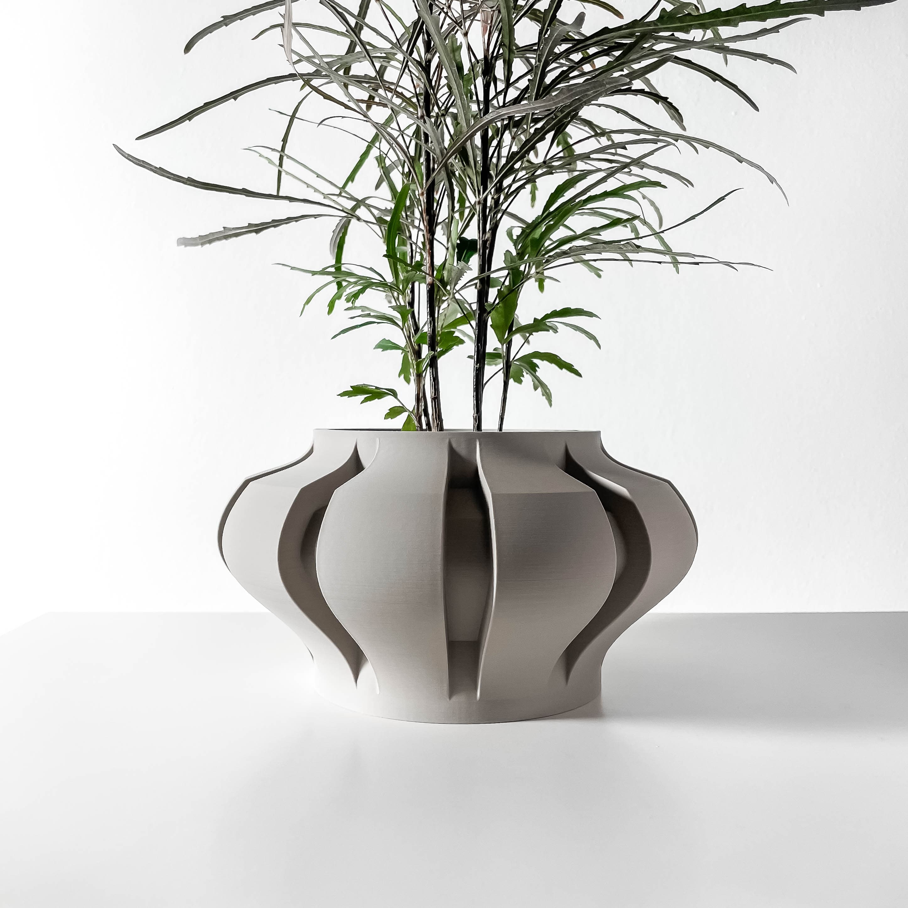 The Ariko Planter Pot with Drainage Tray & Stand Included: Modern and Unique Home Decor for Plants a 3d model