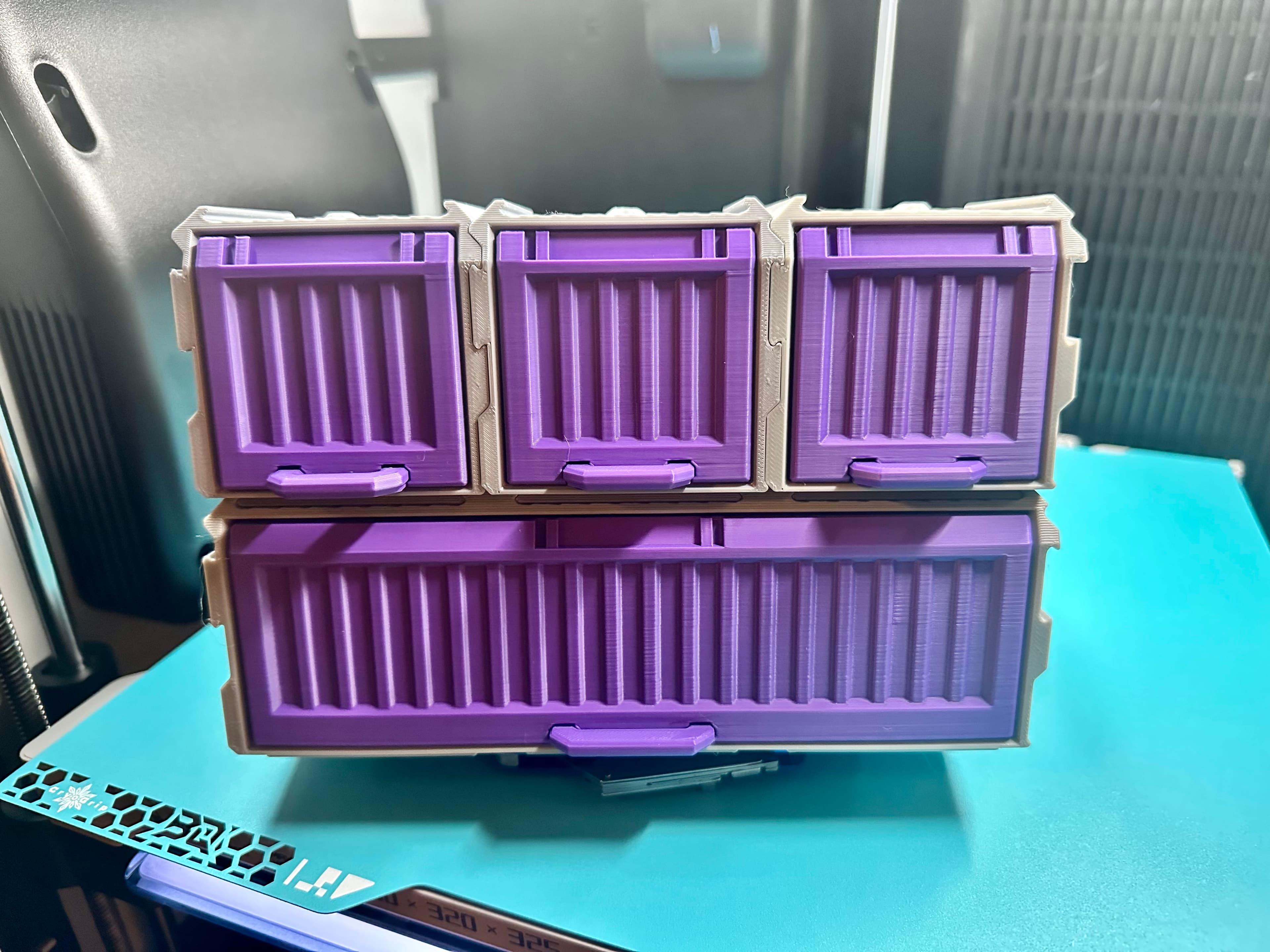 So I did a thing... I love the 3x1 Storage Bins. But sometimes you need a bit more space. So I made a 3x2x1 version (WxDxH). I still thinned out the walls as I did for the 1x1 to add 25% more space vs the stock 3x1 and then went double deep (100mm internal depth). The lock functions normally and all back and side connections function normally.
This design prints in just 4.5 hours for the case and 3.5 hours for the internal components on my X1C and H2D. It opens up the ability to store larger items and one other really wild idea I have that'll take me a few days to design. I also plan to increase the width of the rear articulating arm to support even larger items (so it doesn't become a point of failure). Still have to figure out how to reduce the opening angle.