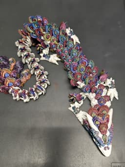 I used three different tri colored PLA silk filaments to create more of a variation in the peacock feathers. 3d model