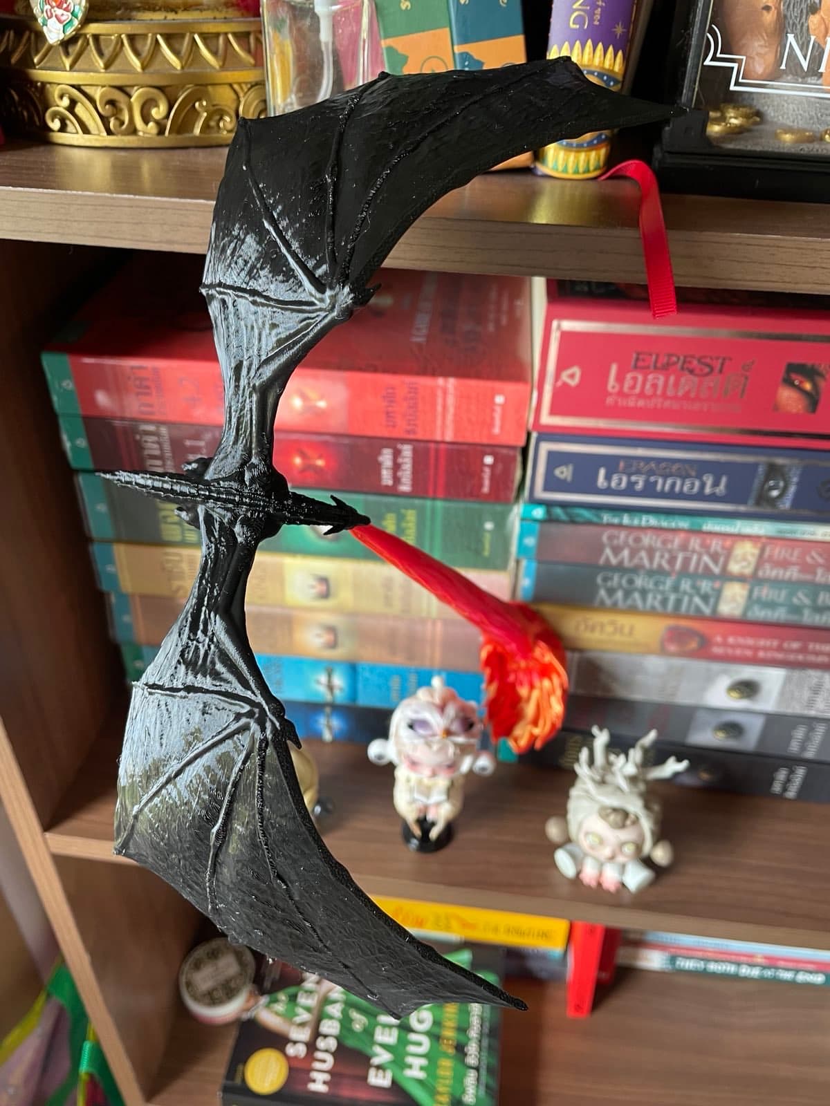 Came out amazing! I've never been so excited for a print. I've also never paid for a model before... In my 10 years of having a 3D printer, I've mainly used it for functional prototyping for work- I'm not really a model/figurine type of person. Although I wanted to print this for my wife and it was half the reason I bought dual color silk PLA, another first for me. I am extremely impressed with this model. The flames look great and everything printed smoothly. I printed the base in PETG, the flames in Gold/Red Silk PLA and the dragon is just plain Black PLA. The tip of the flames broke where the dragon connects when I first set it up which makes me wonder if silk PLA isnt as strong or I need to use a higher temp but I just carefully put some super glue there. May glue the dragon and flames together but for now it all sits nice. Super happy with how it looks. Amazing design!