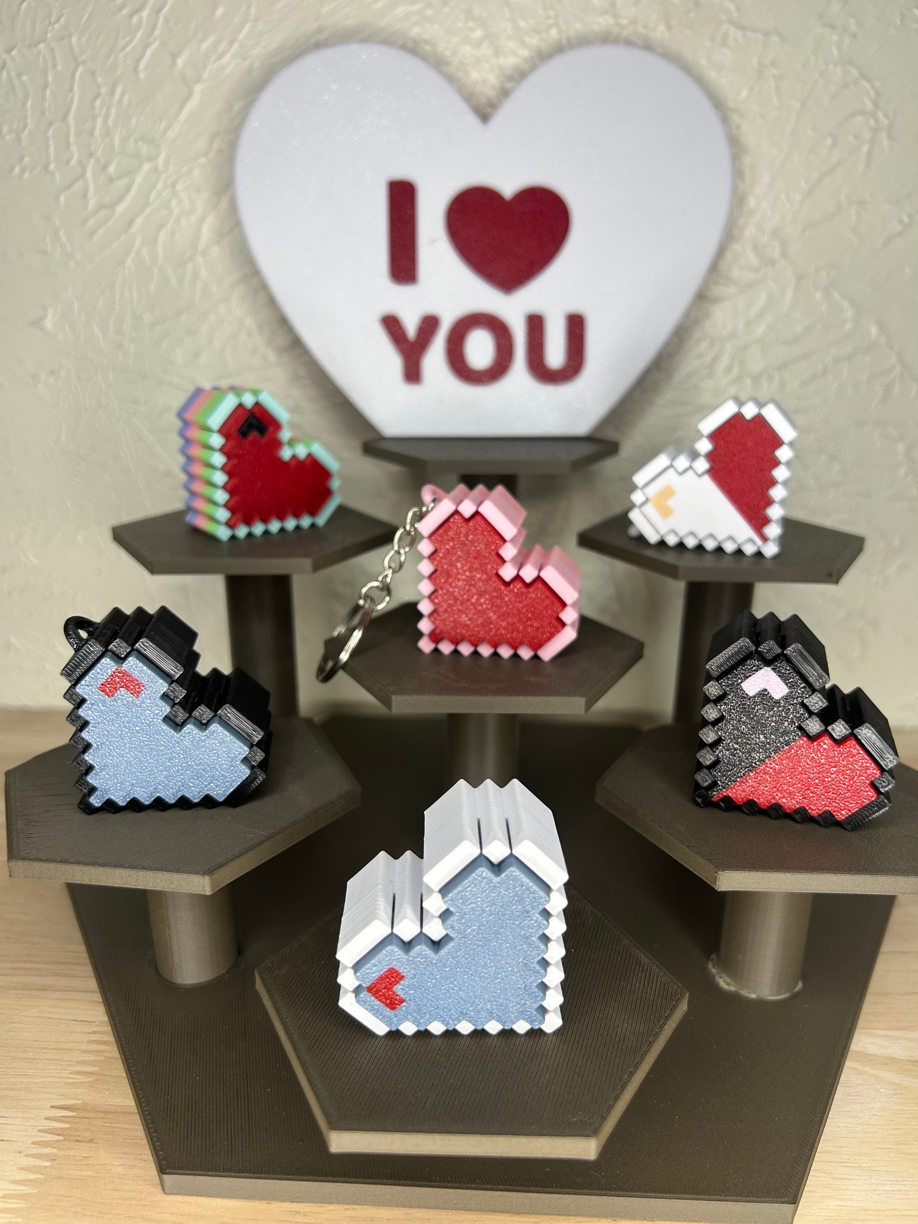 Love is in the air! These heart clickers are super easy to print with no issues and no need for AMS. Another great model by IK3D. Printed on the A1 Combo and Neptune 4 Pro. Using eSun Fire Engine Red pla, Polymaker Black PLA, Lovoon Macron Rainbow, Eryone White pla, Elegoo Matte Pink PLA and eSun Grey PLA.