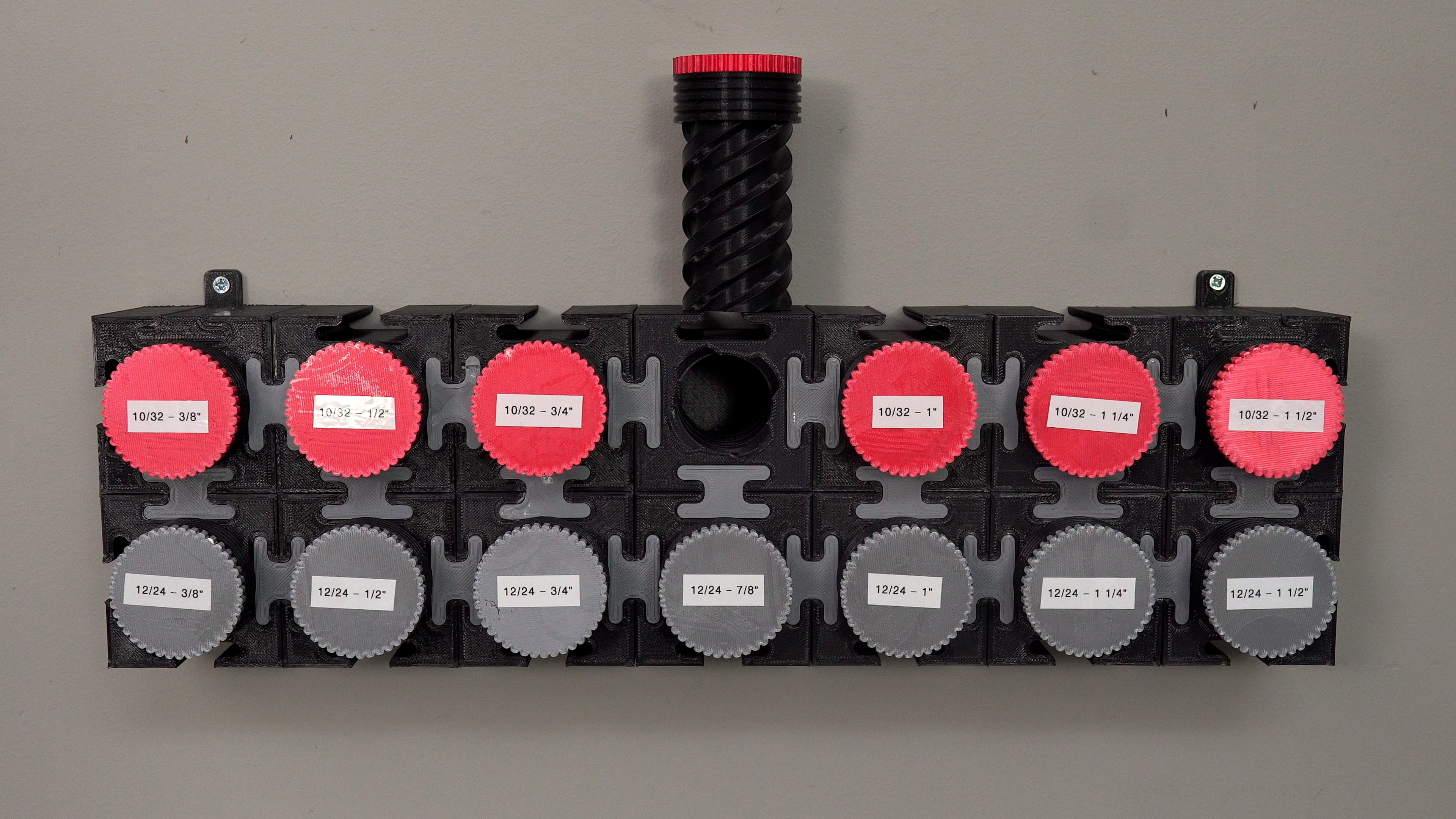 Modular Bolt Organizer - This is a 2x7 matrix of the bolt organizer, which is mounted to my wall. The color of the cap symbolizes the pitch and diameter of the bolt, while the white label designates the length. - 3d model