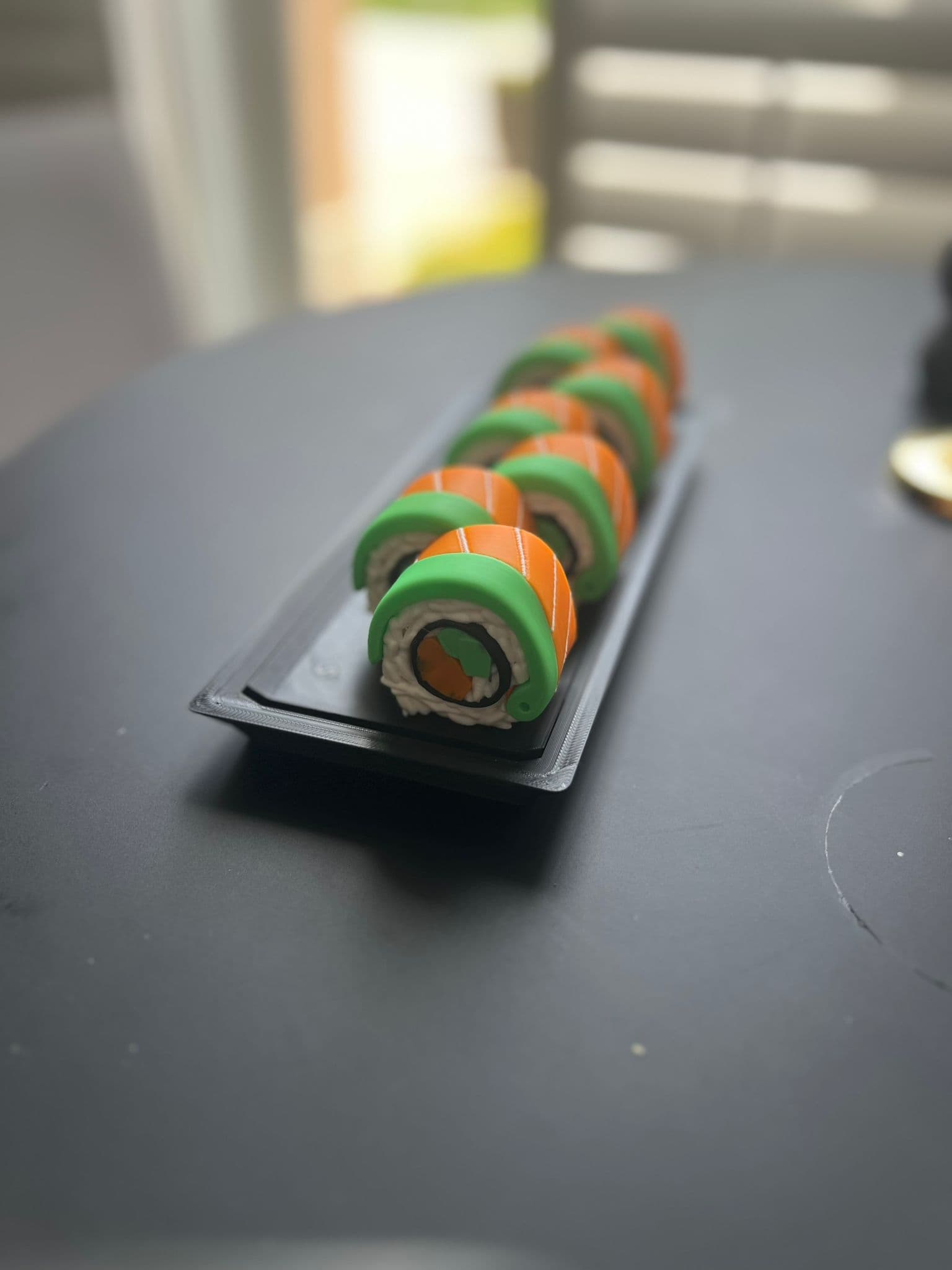 I became OBSESSED with these adorable sushis! I printed nothing else for like two weeks! I made so many different combinations and most of them turned out soooo gorgeous. The only ones I didn't love were because I tried to use filament I had on hand and the colors didn't fit or wipe properly, given I didn't adjust settings to adapt. I'm new at this! I also got a message from my bambu slicer that told me the rice should be "simplified" and both the rice and the filling needed to get "fixed" by a 3rd party site because of "manifold edges"(???), and this got confusing for me. Also, I purchased the keychain attachment from the link, but it didn't come with any directions and felt overall too small anyway, so I will have to go in person to a craft store to find the right kind of keychain. That kind of thing can be so hard to buy online since there's no sense of scale. Any advice would be welcome because I know this is what everyone I know is getting for Christmas! Delightful!!!!