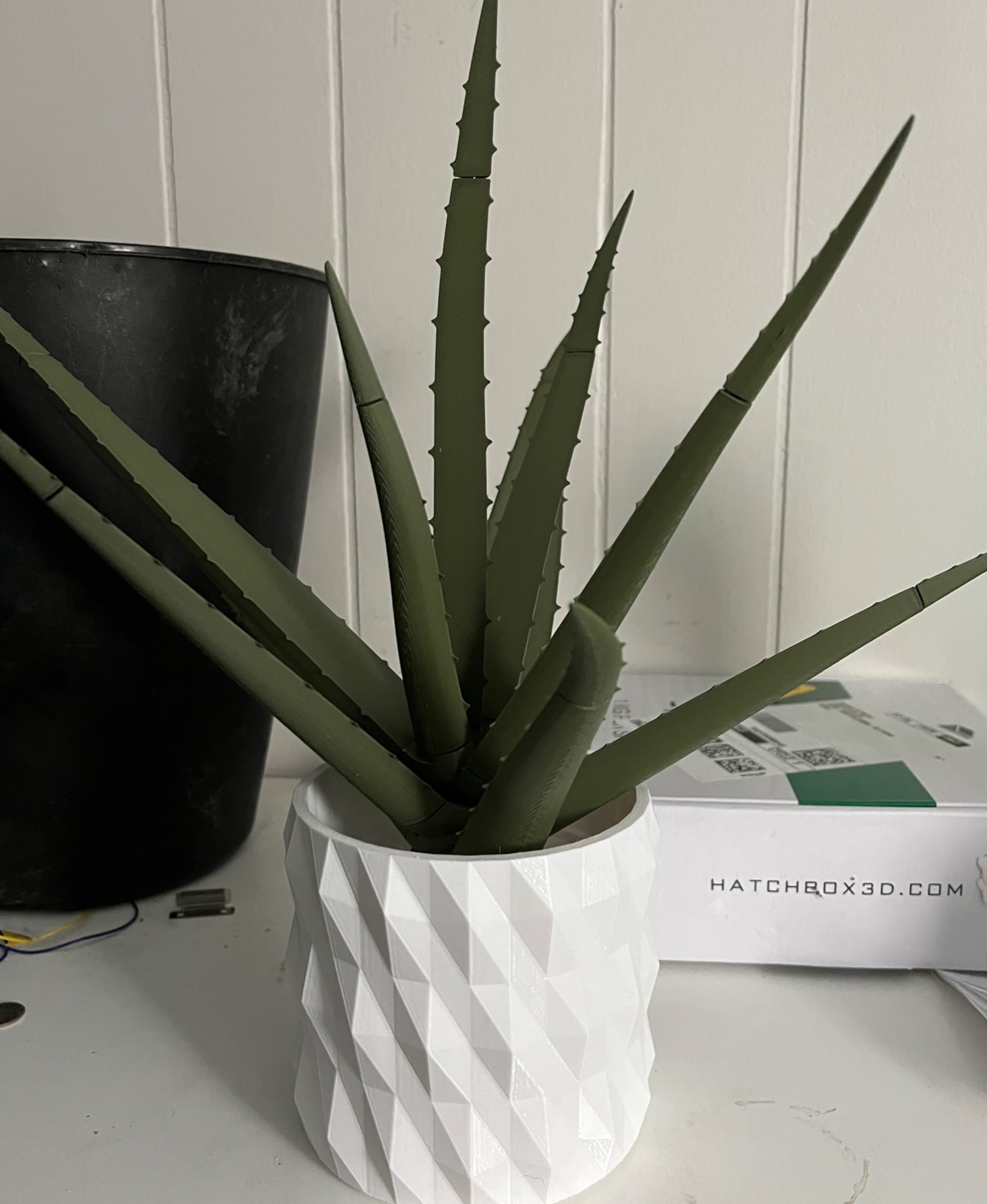 Printed with Hatchbox white pla and Eryone olive green pla. Opted to paint the spots on later tos ave filament. I didn’t have any red clay-like filament so I made my own white geometric planter that I scaled to fit the insert in blender.
Tips: Hit the stem holes with a heat gun on low for maybe 10 secs each to make it easier to get the pens down in them.
Bore out the caps with a small rasp/file or exactly knife for a better fit. I’ve still got a few to fine tune.
Once you get magnets in the base, give each installed magnet a pair and mark the outward face with a sharpie so you don’t install it wrong into the stem.
Use a flat surface on a pair of pliers to persuade the magnets into the holes easier.
If you dial in your printer this all fits together very well! I printed mine across an A1, an A1 Mini and a K1 Max and everything is fairly snug and lines up well. Great design! Kudos Forge! Thanks for sharing.