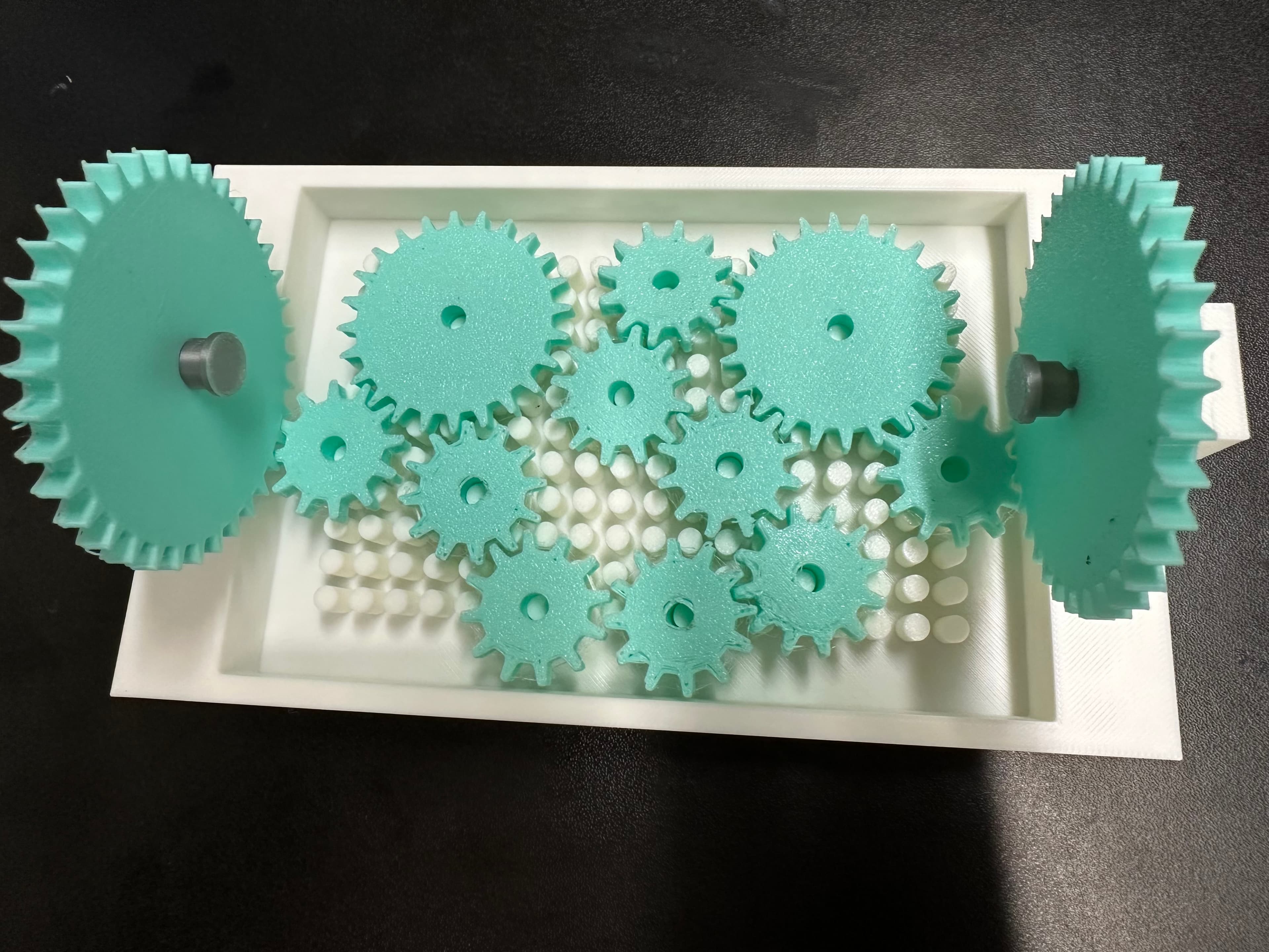 a couple of the gears failed during printing due to bed adherece. Reprinted and they seem okay for now. Was able to fit all 11 pieces on, but can't get them to turn. Plan to make a few more of these to use with my elementary STEM students.