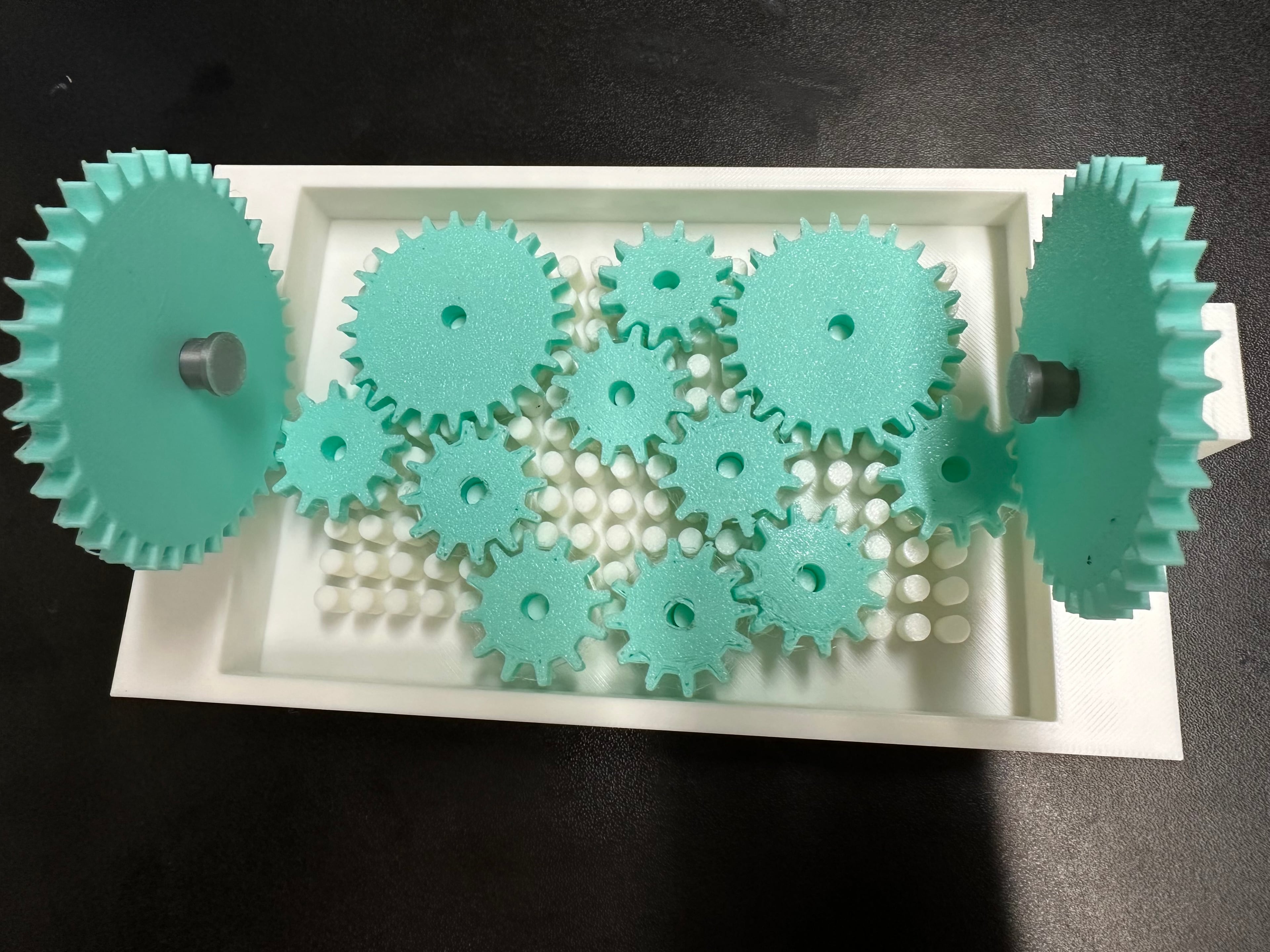 a couple of the gears failed during printing due to bed adherece. Reprinted and they seem okay for now. Was able to fit all 11 pieces on, but can't get them to turn. Plan to make a few more of these to use with my elementary STEM students.
