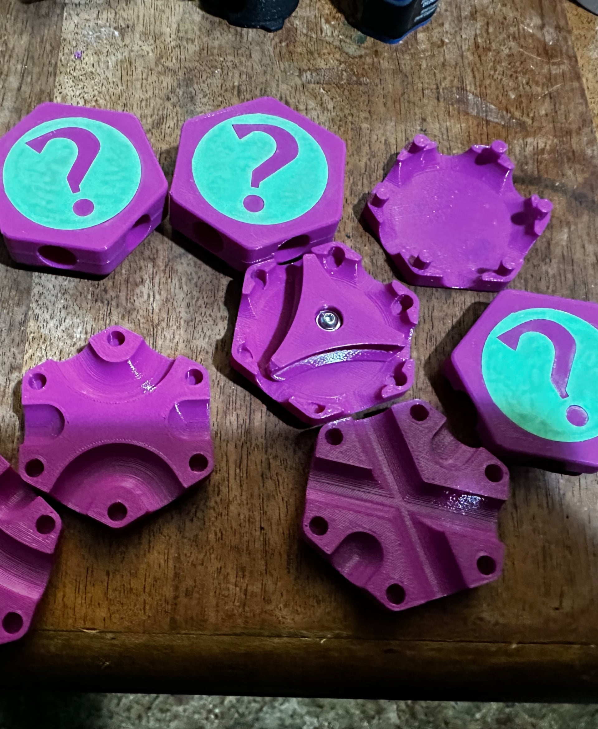 These were kind of a pain to print. Thankfully I read through the comments and makes first and learned that the I need to get corrected tile bodies - the X, DC and Flipper tiles all have holes that are too shallow for the cover so I used these corrected models:
DC, X - https://thangs.com/designer/johnlattanzio98/3d-model/FIXED%20Secret%20Hextraction%20Tiles-878686
Flipper - https://thangs.com/designer/timothyjackman/3d-model/Fixed%20Hextraction%20Secret%20Flipper%20Tile-884171
For the cover - I printed them with the "top" (the question mark) down, and used supports. Then, I shrunk the inlay down to .4mm thick instead of .6mm, that way they fit in nicely when I glued them in. Looking forward to getting my MMU3 unit so I can reprint these in multicolor without gluing the inlays in.