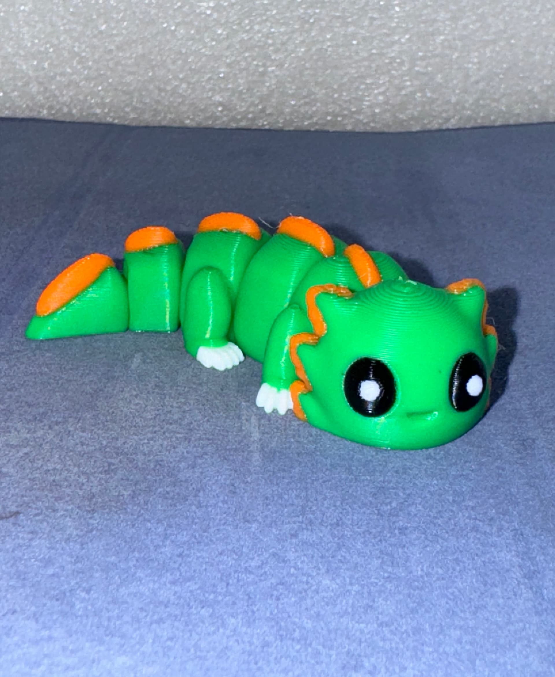 This little guy is happy to be.
Bambu PLA green and orange, Eryone PLA black and white.