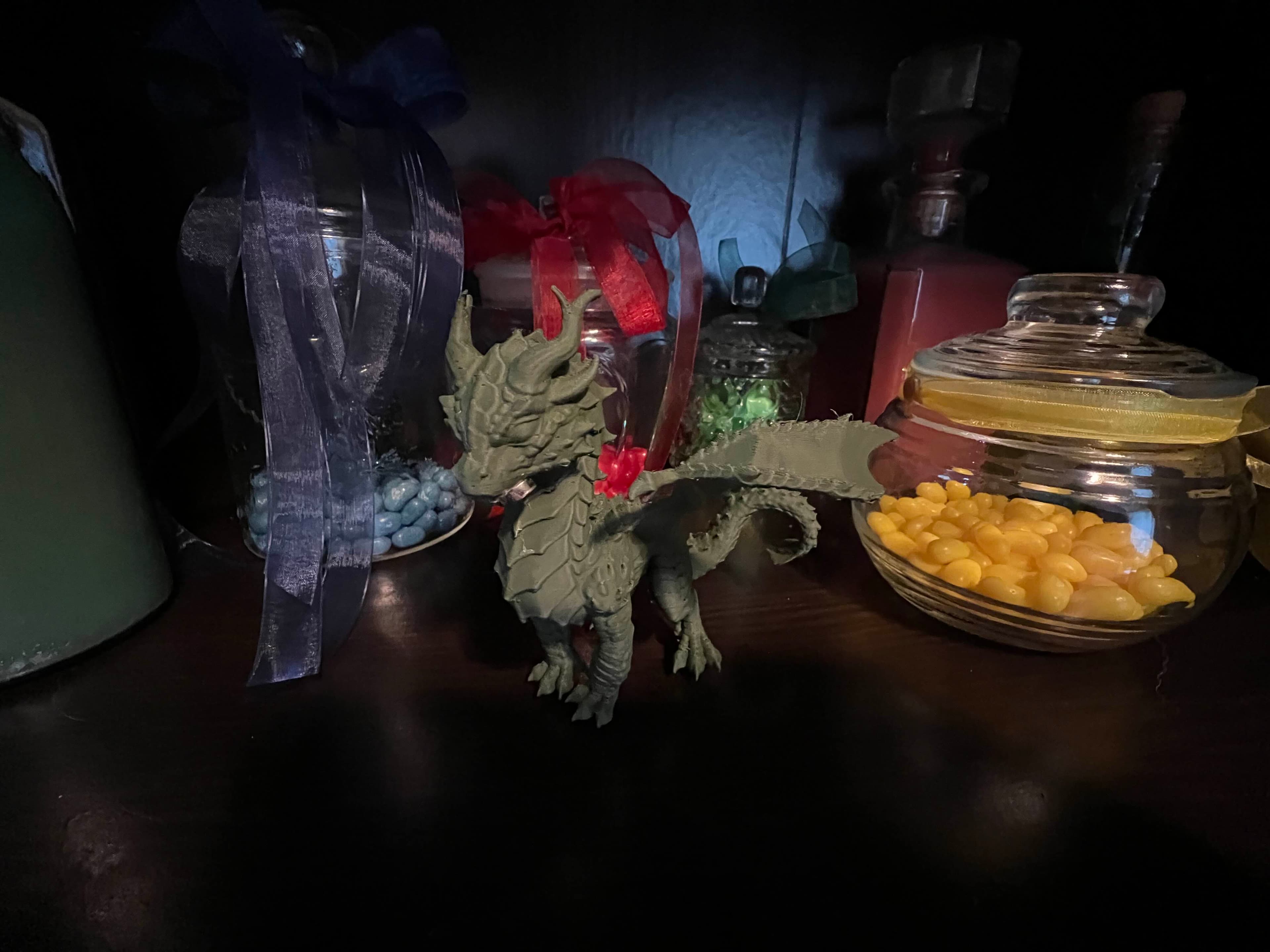 Printed at 400% in green PLA filament, after printing a test in white at 100% size (second image).
Glued a magnet under the chin as part of a mini game for an escape room.