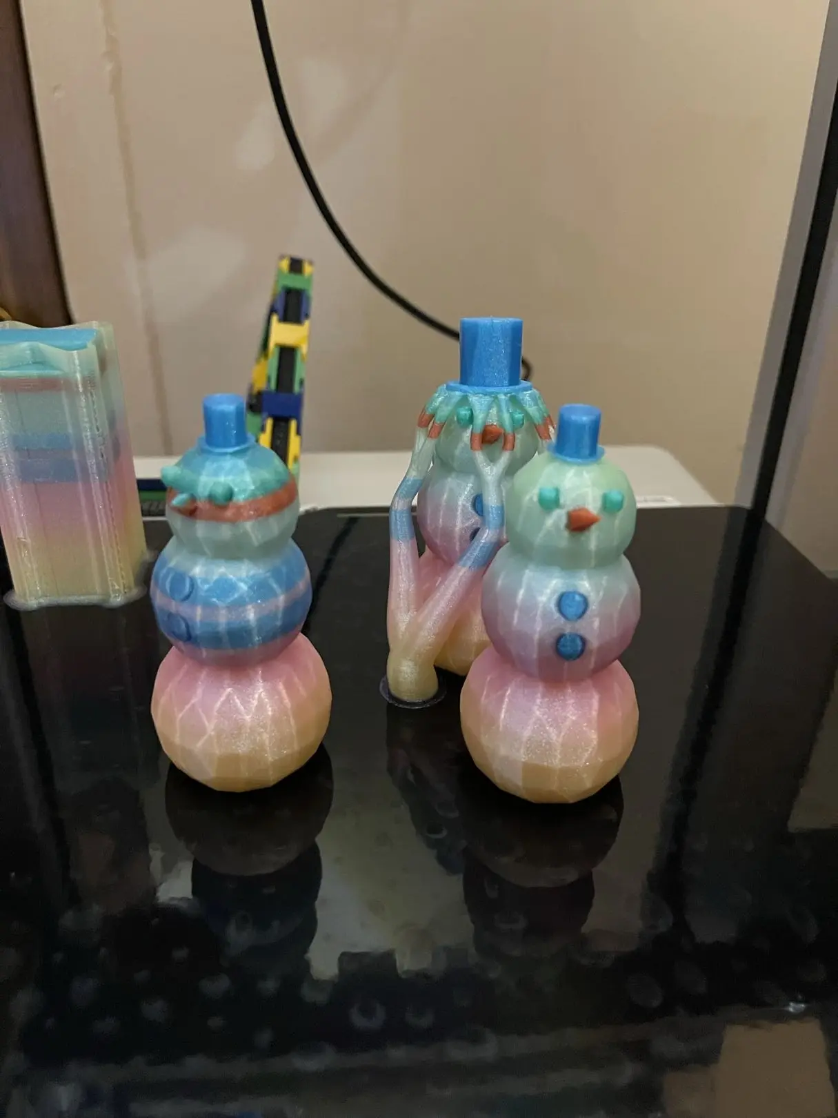 So the for the blue ones I didn't realize the supports were manual and I was rushing to get the print going and it failed....but i still like them. ROUND 2! I switched things up and even made the hats low poly, these are using cookiecad and the orange is protopasta