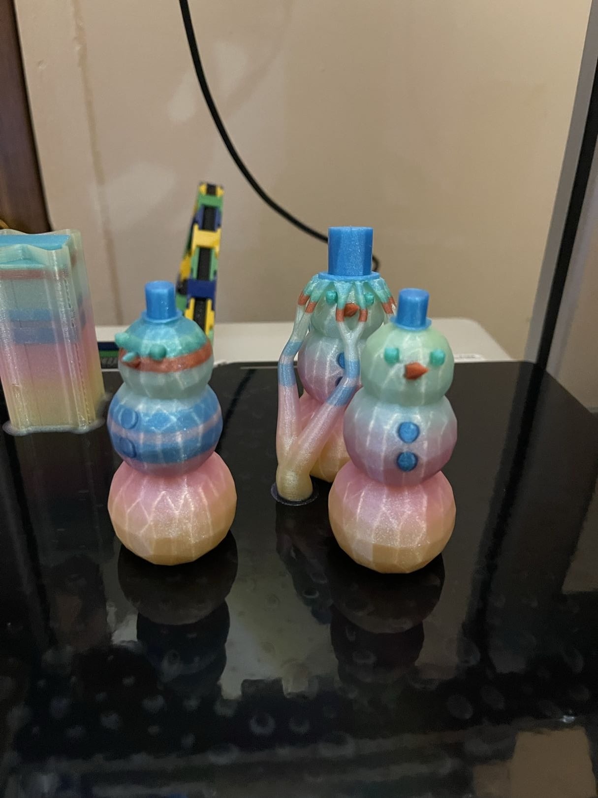 So the for the blue ones I didn't realize the supports were manual and I was rushing to get the print going and it failed....but i still like them. ROUND 2! I switched things up and even made the hats low poly, these are using cookiecad and the orange is protopasta