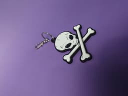 Flat 3D Textured Alien Skull and Crossbones Keychain 3d model