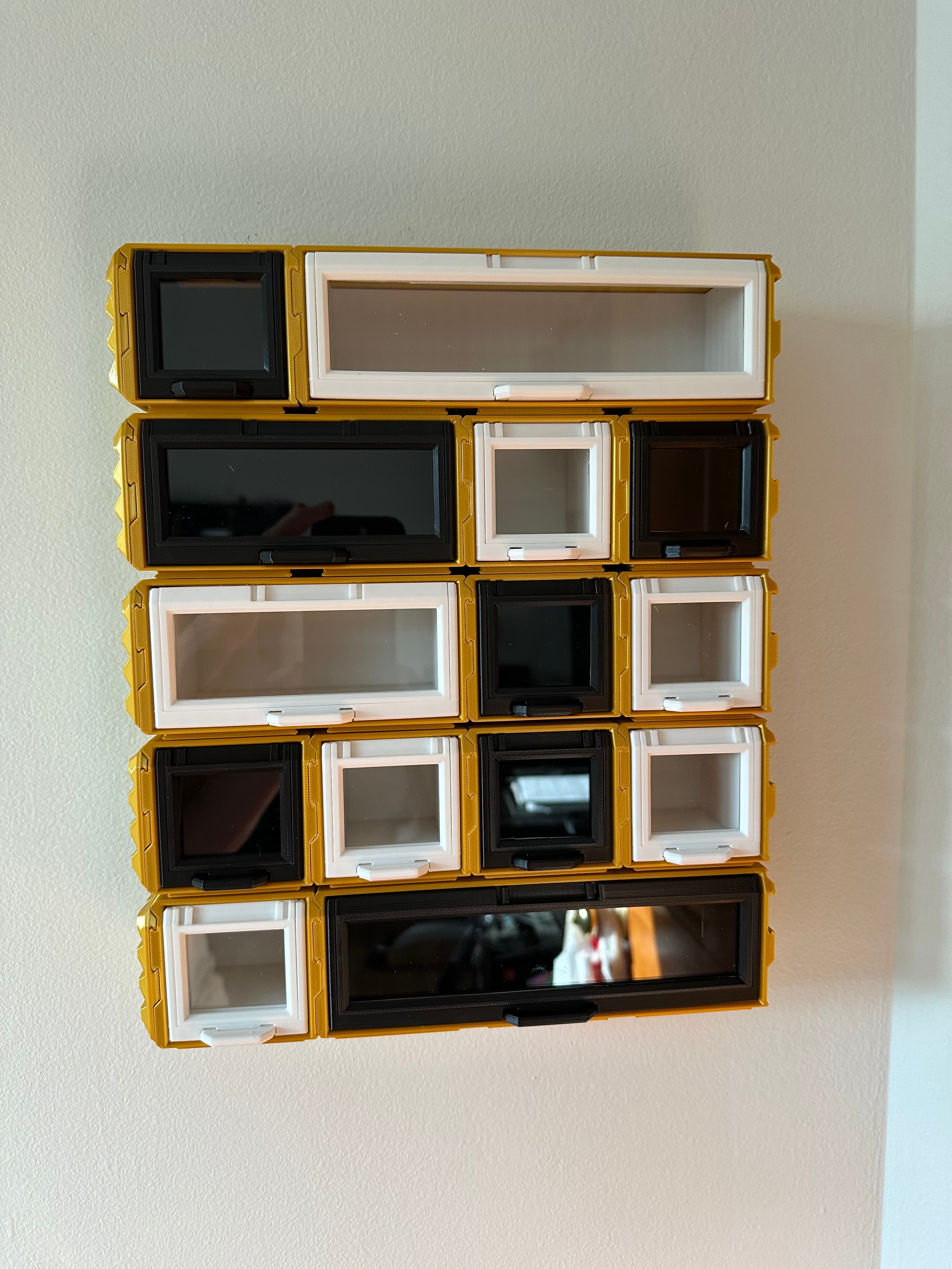 Very nice design, the box tilt and lock mechanism is very well done.
I took the interlocking bits off the top of all boxes so I could slide rows independently, interlocking rows seemed very limiting.
I also made end caps so the rows can’t just slide right off… the slide on the side of the end box and lock on the rail plate tabs.